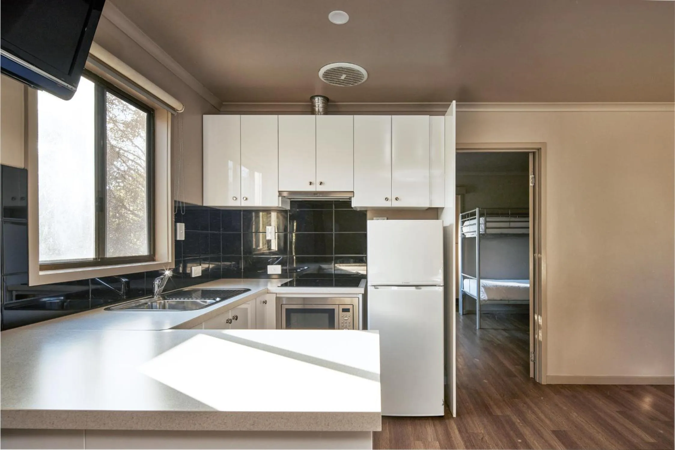 Kitchen or kitchenette in NRMA Port Arthur Holiday Park