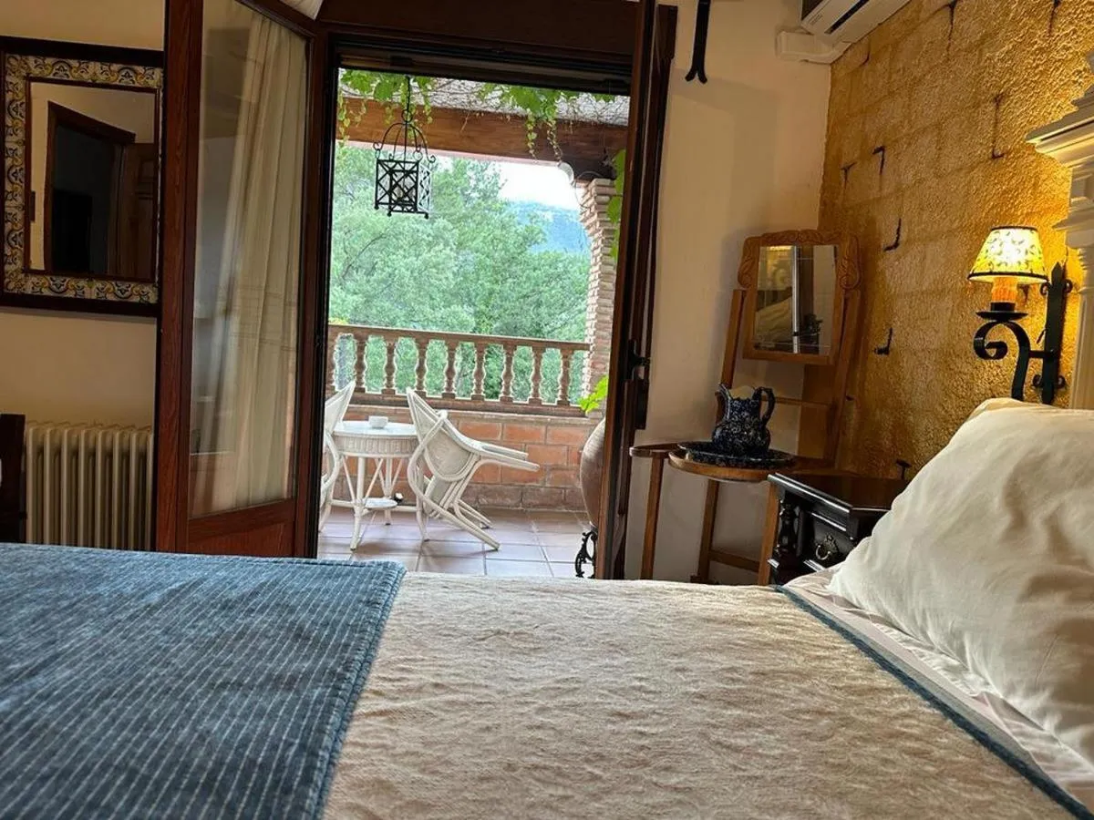 Bed in Hotel Rural Convento Santa Maria de la Sierra