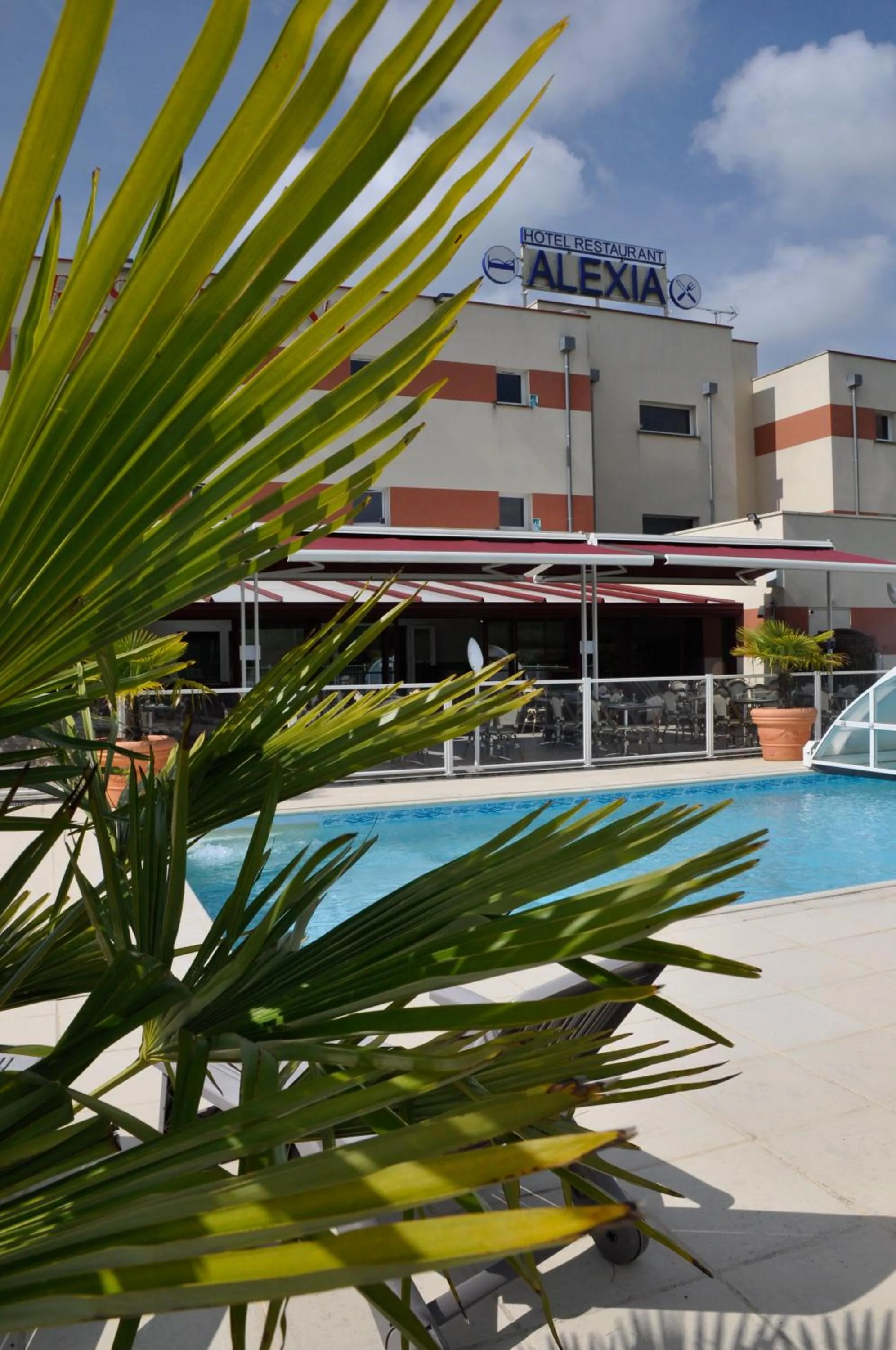 Swimming pool in BRIT HOTEL CONFORT ALEXIA - La Souterraine