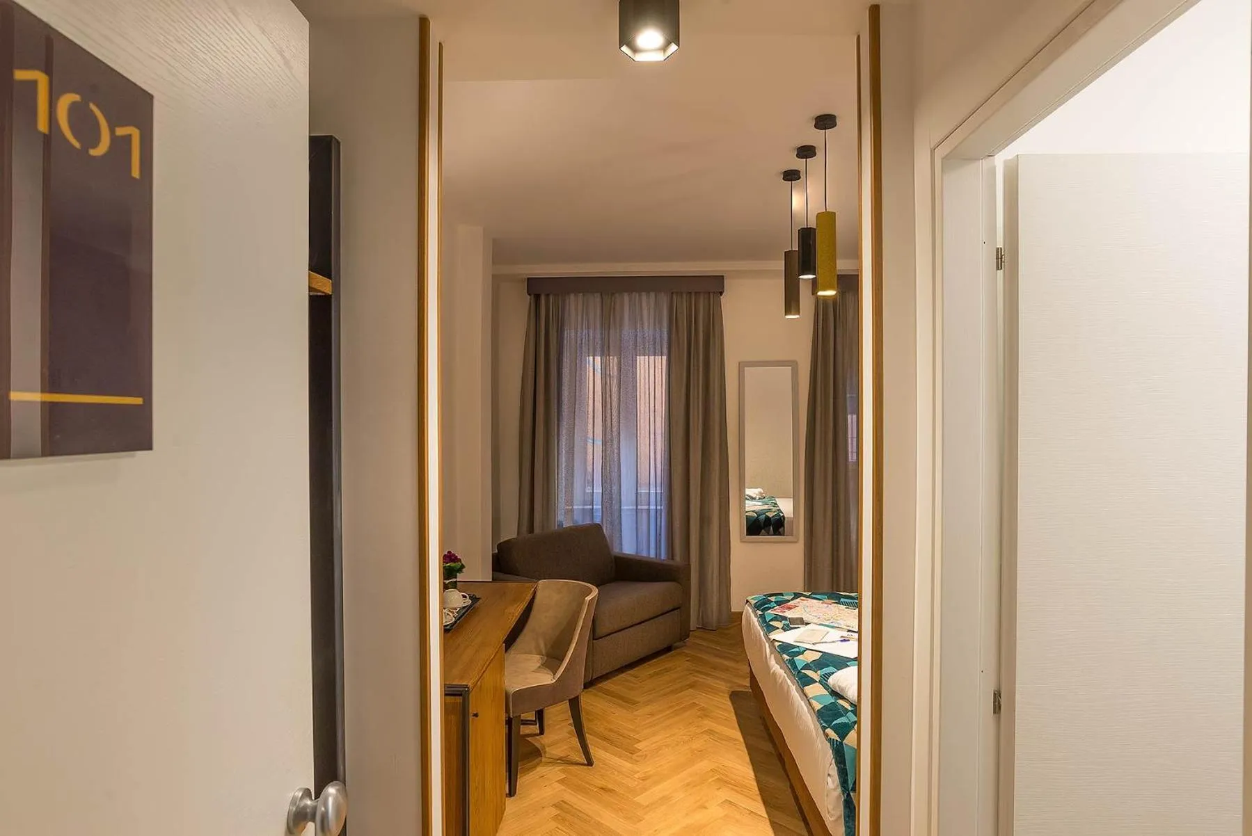 Photo of the whole room, Bed in Navona Essence Hotel