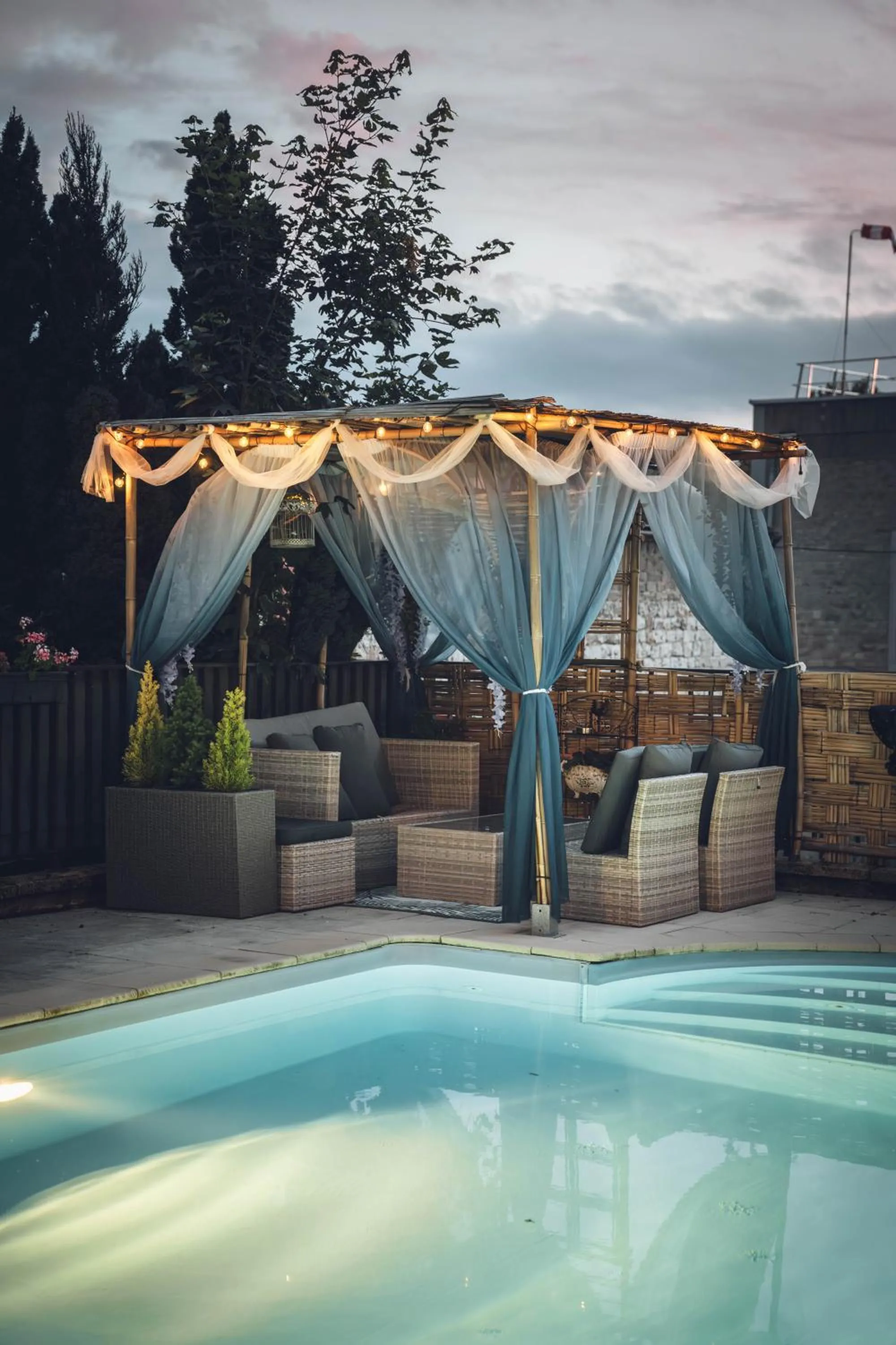 Swimming pool in Logis Hôtel Vuillot