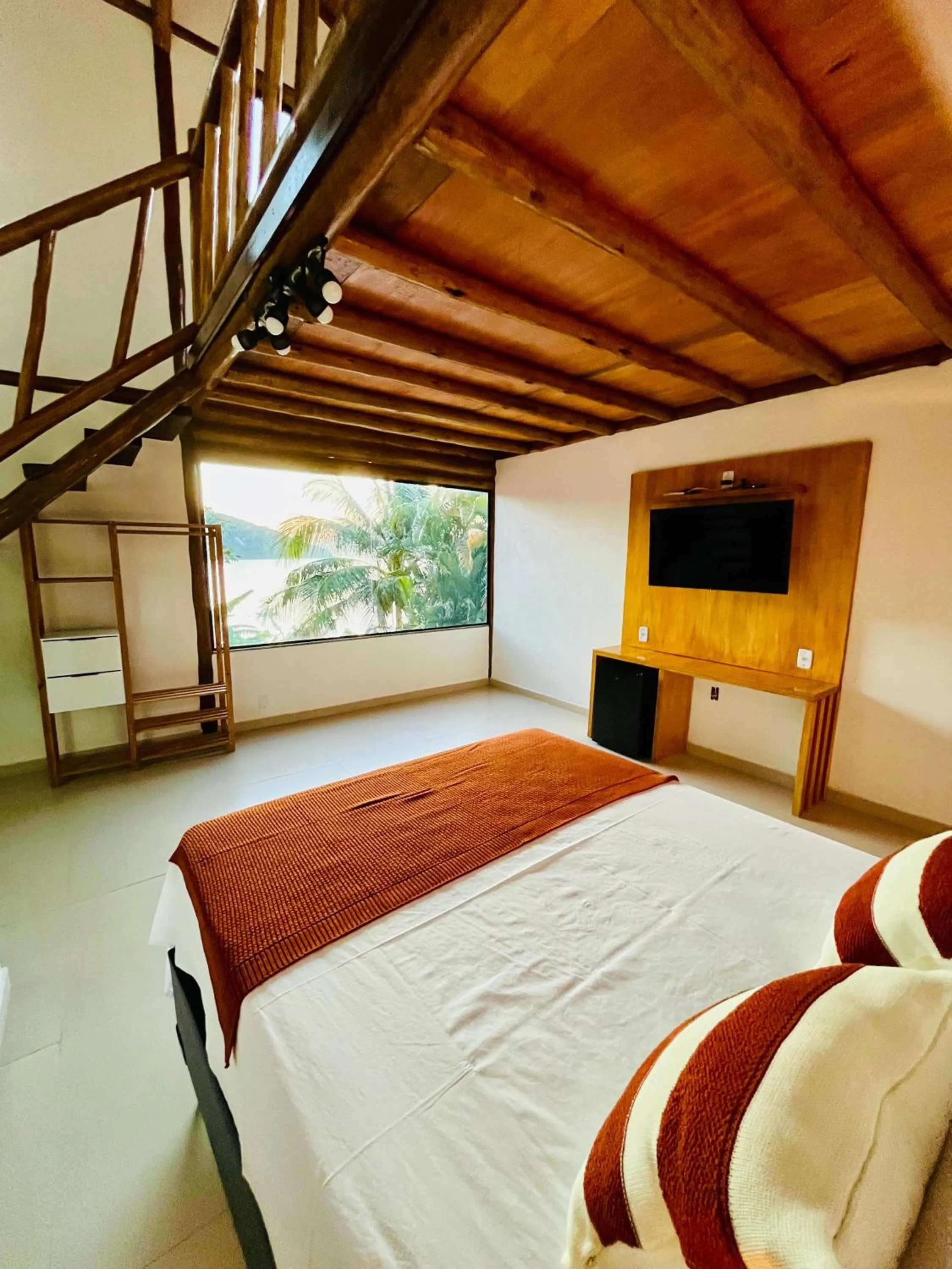 Bed in Pousada Tropical Araçatiba