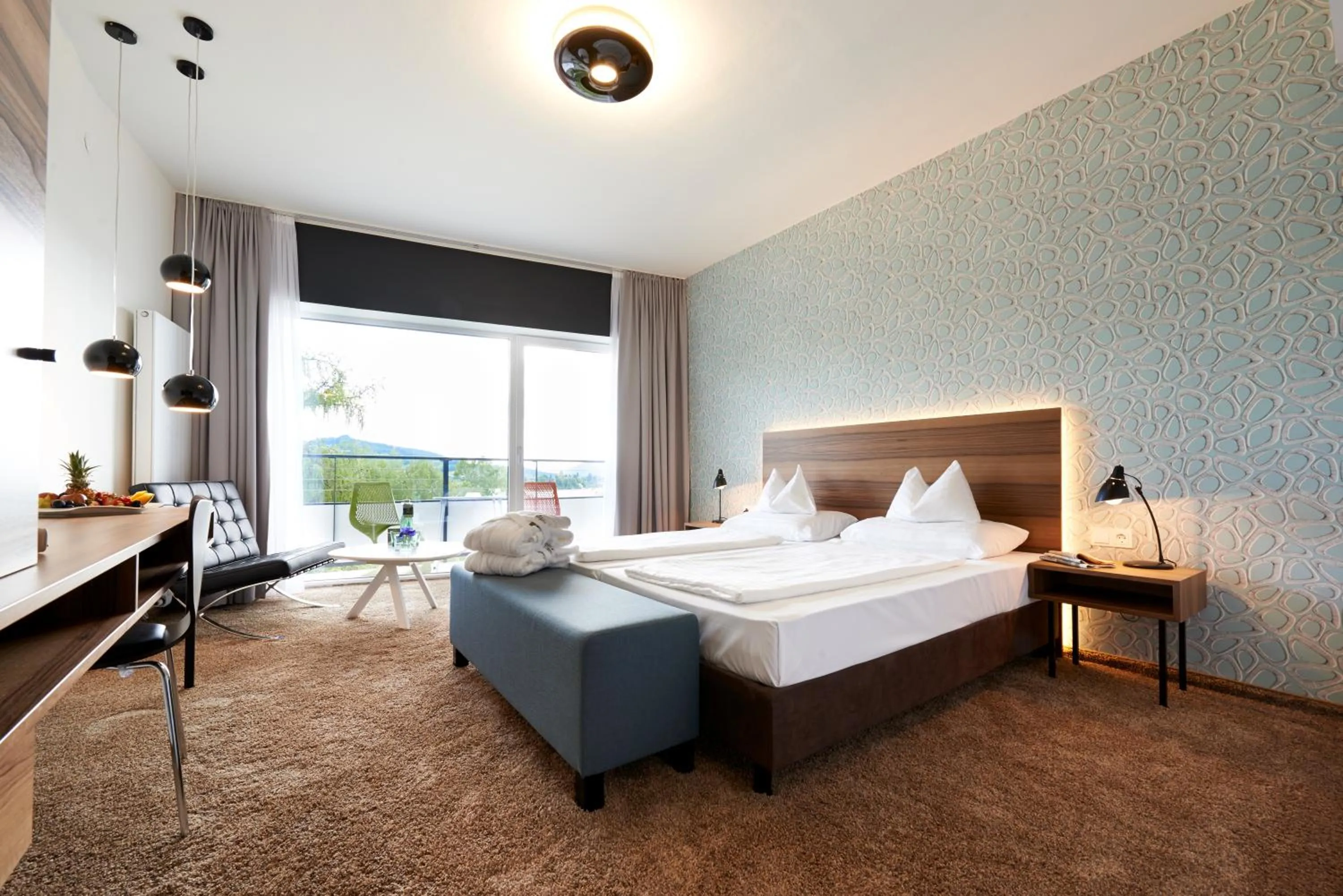 Photo of the whole room, Bed in Parkhotel Pörtschach - Das Hotelresort mit Insellage am Wörthersee