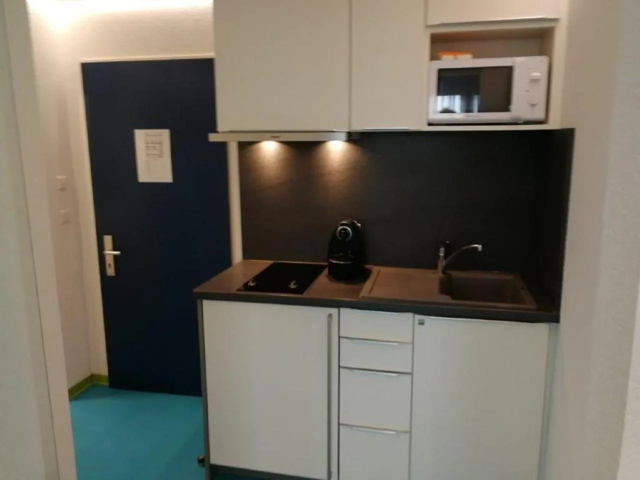 Kitchen or kitchenette in Domus Hotel