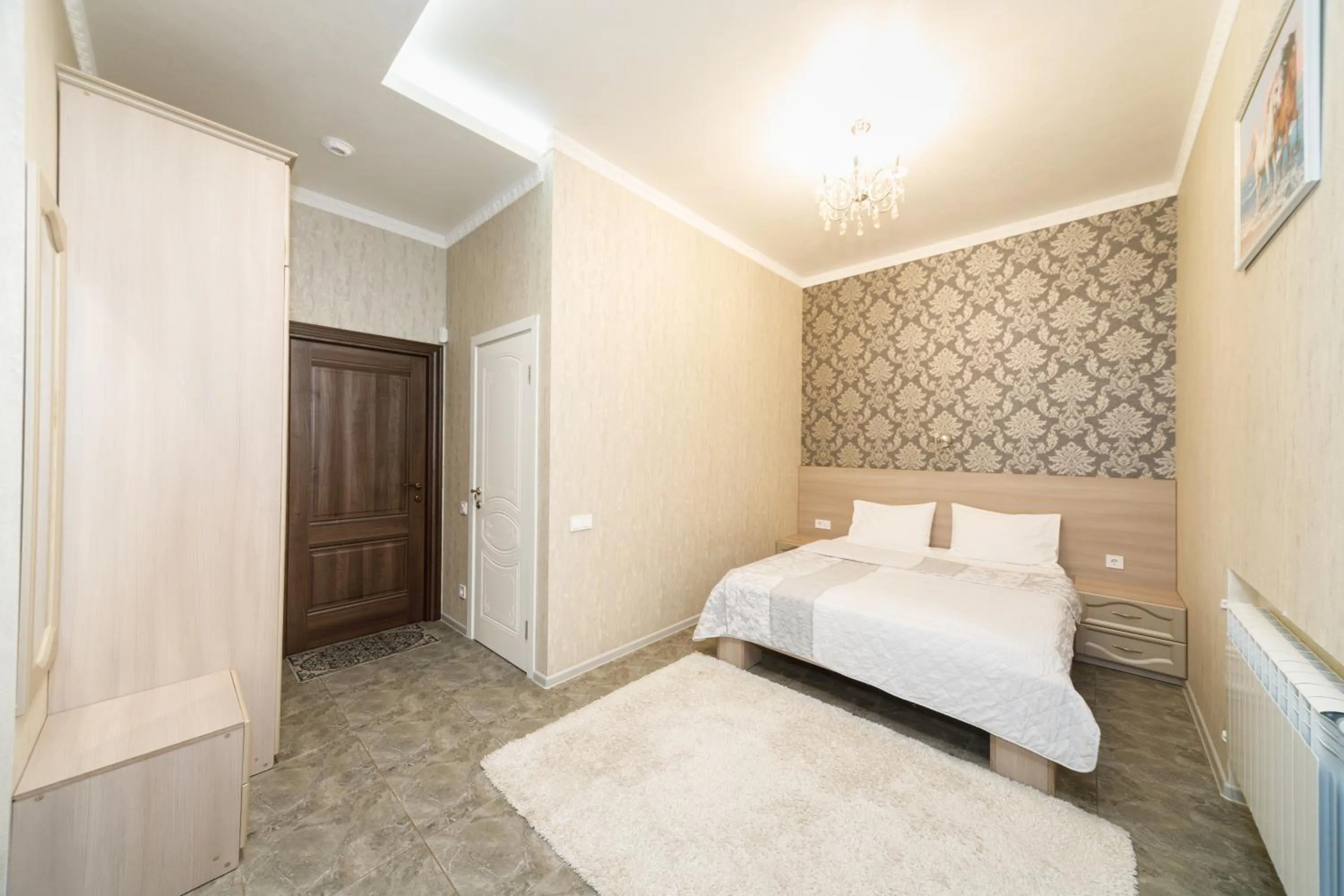 Bed in L.O.Y Family Hotel