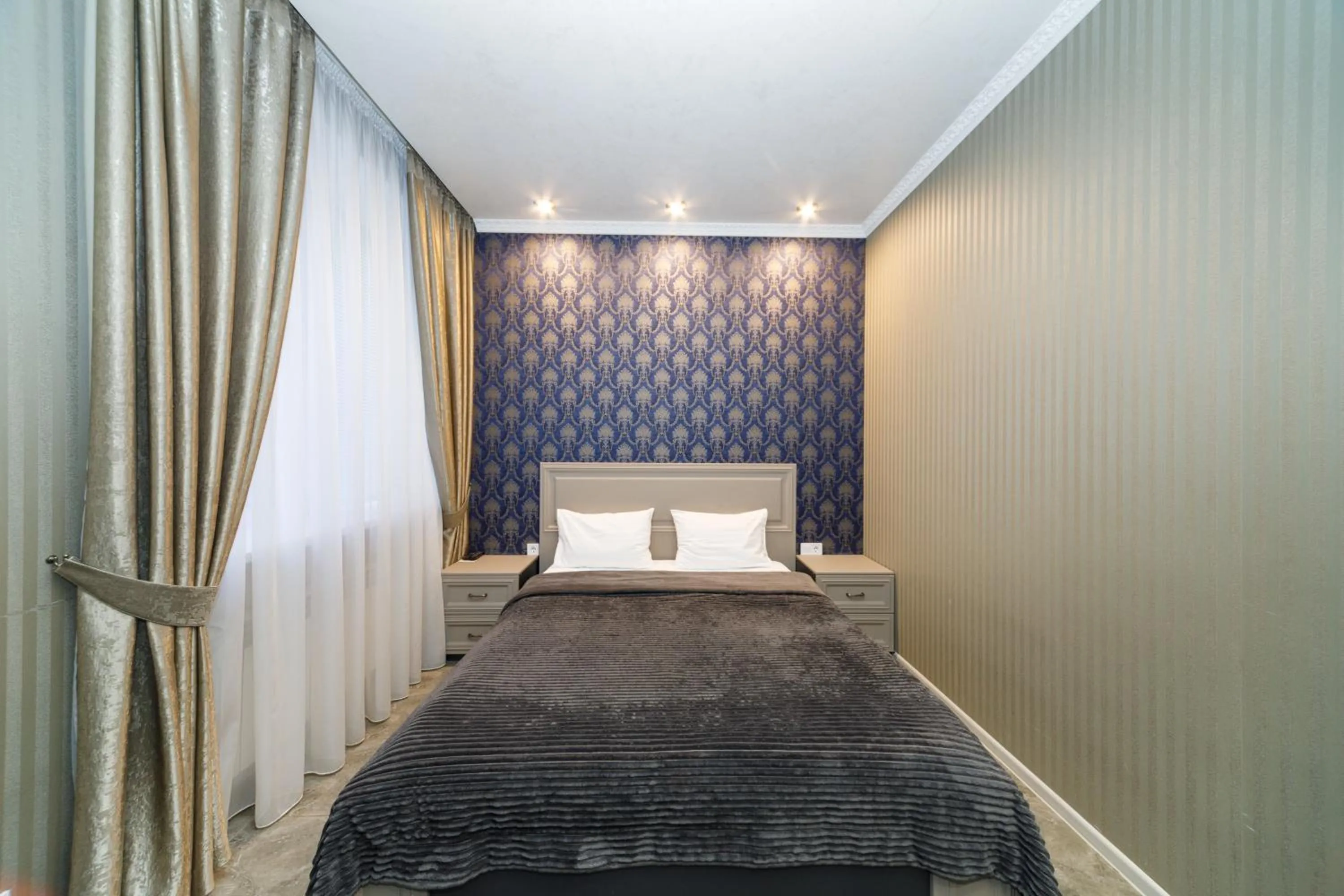 Bed in L.O.Y Family Hotel