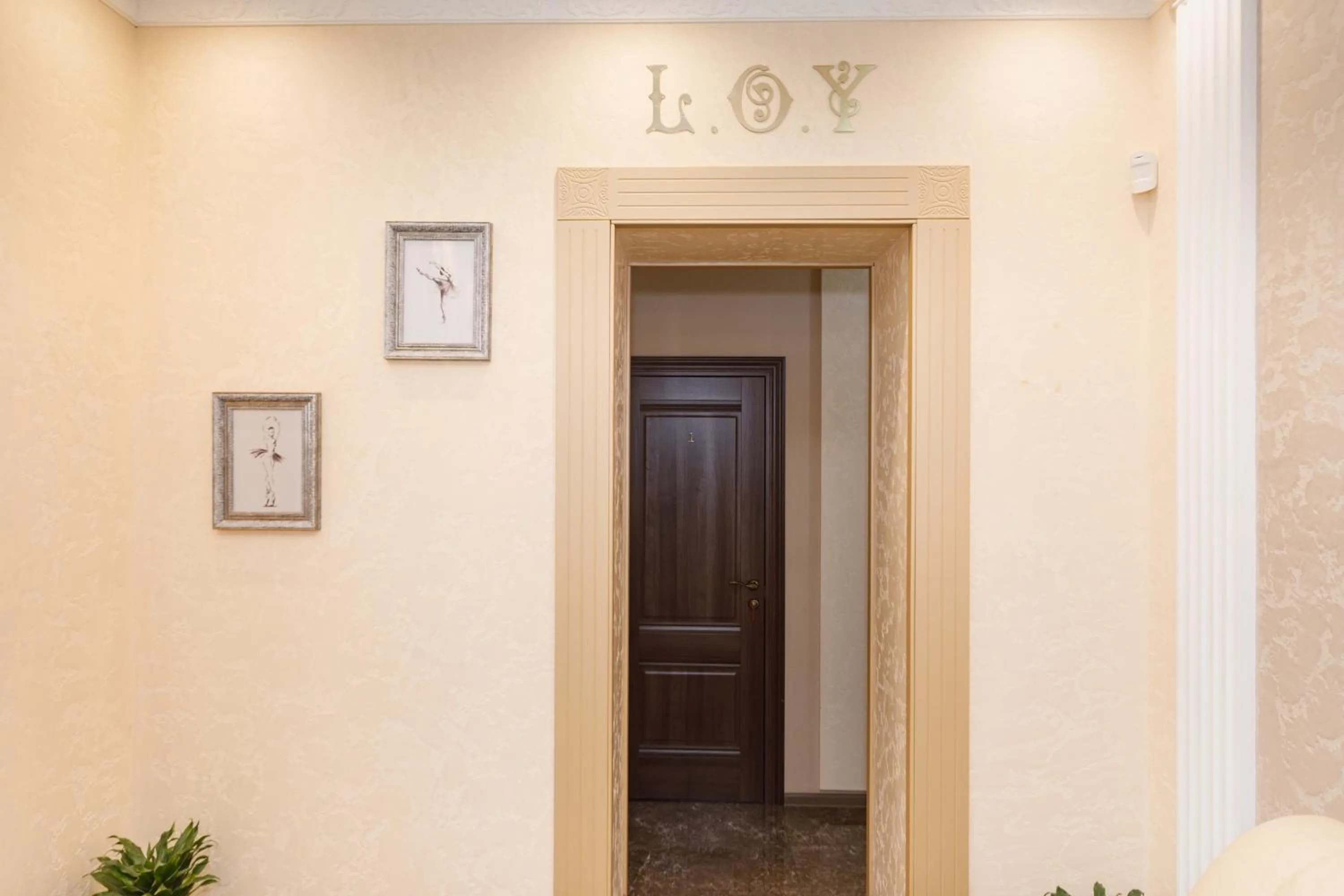 Text overlay in L.O.Y Family Hotel