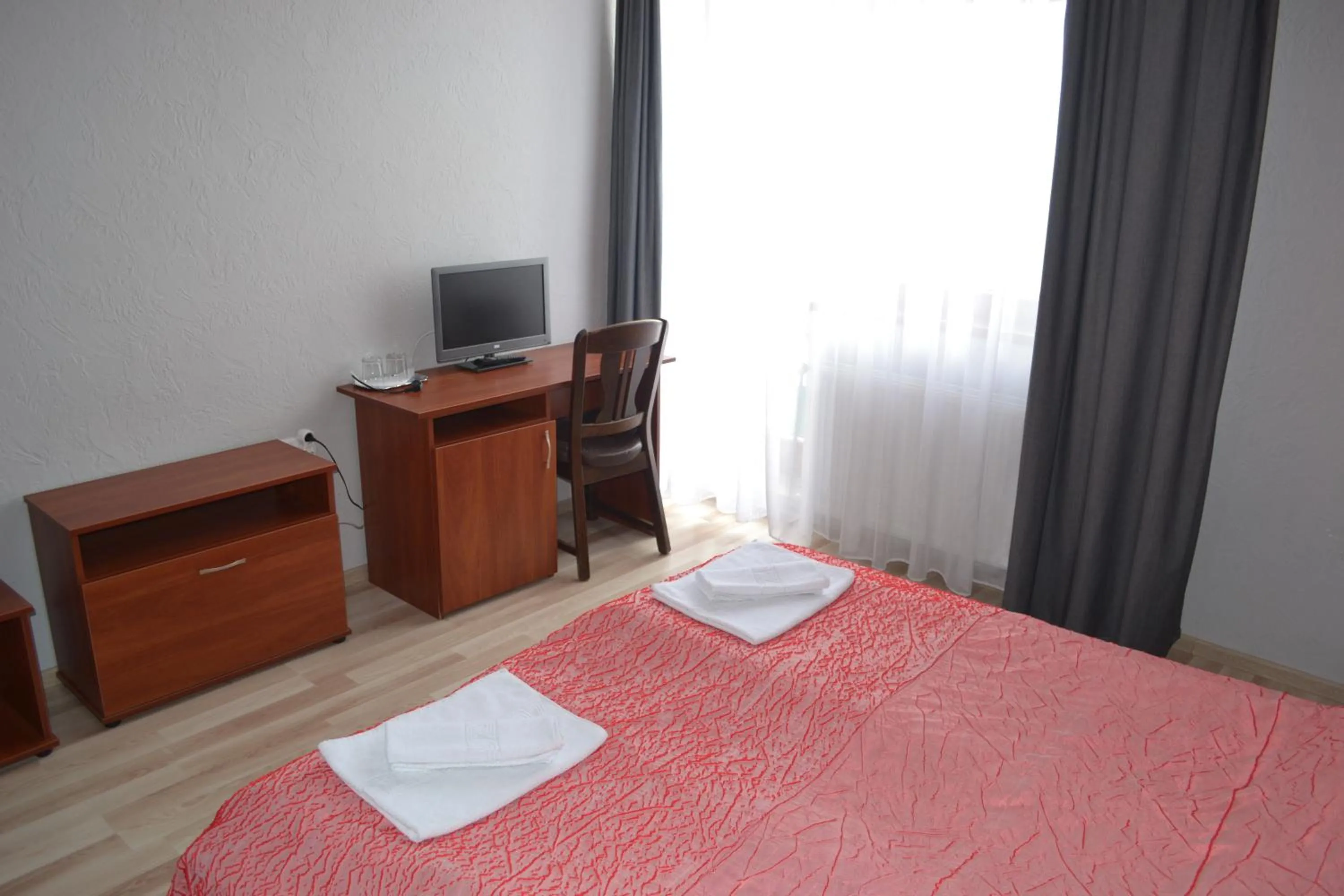 Bed in Hotel Helikon