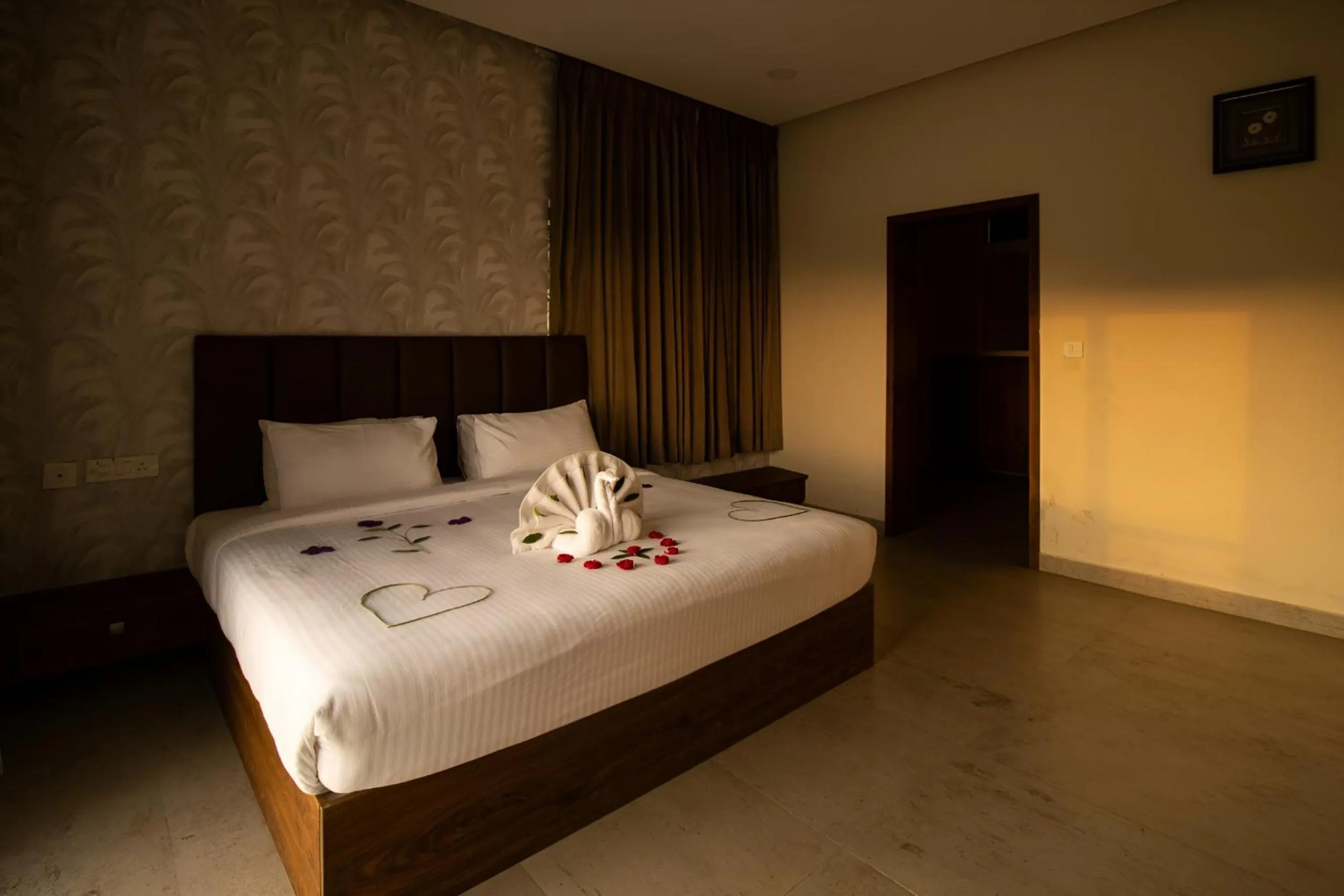 Bed in Elixir Hills Suites Resort and Spa