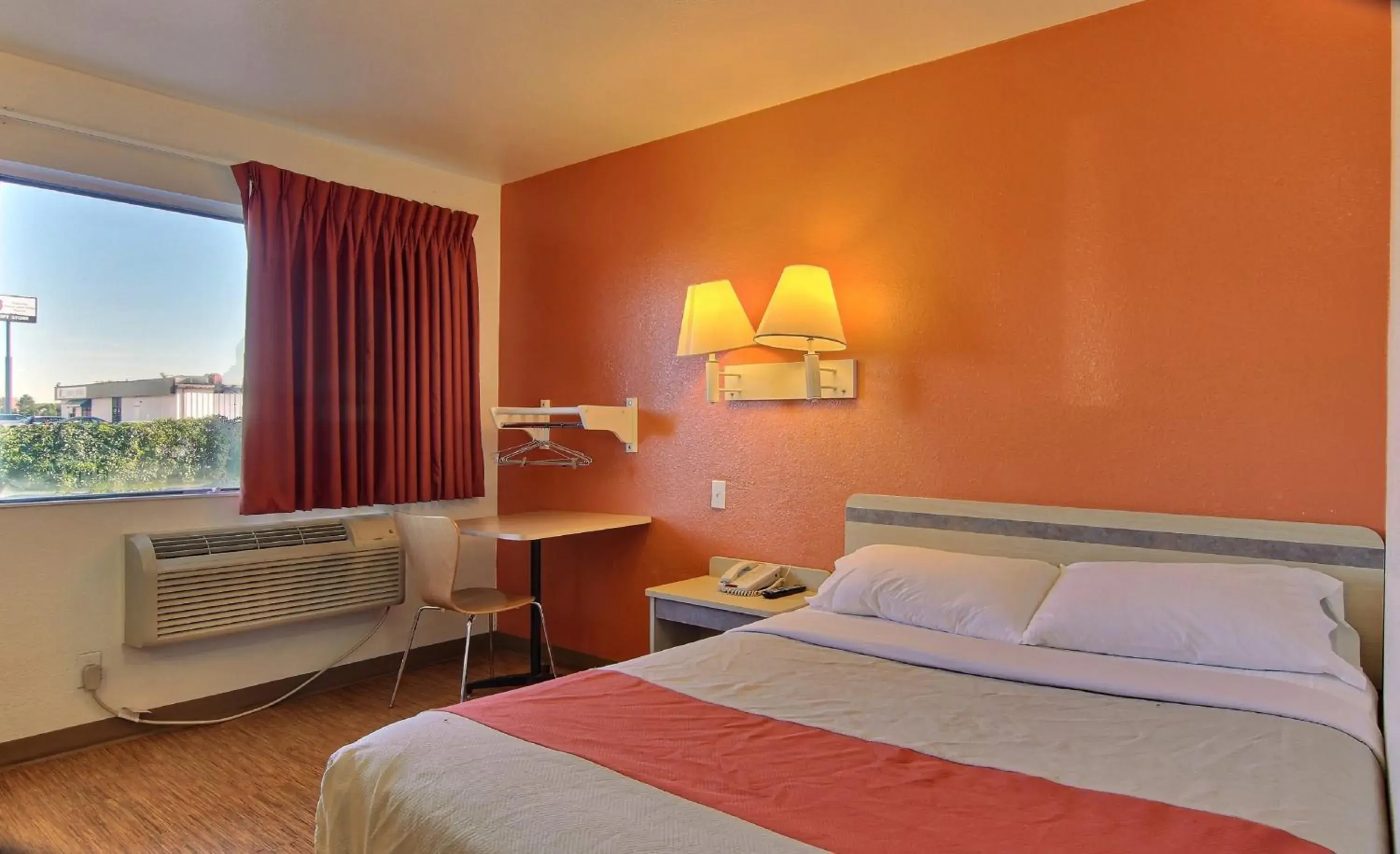 Seating area, Bed in Motel 6 Bismarck, ND