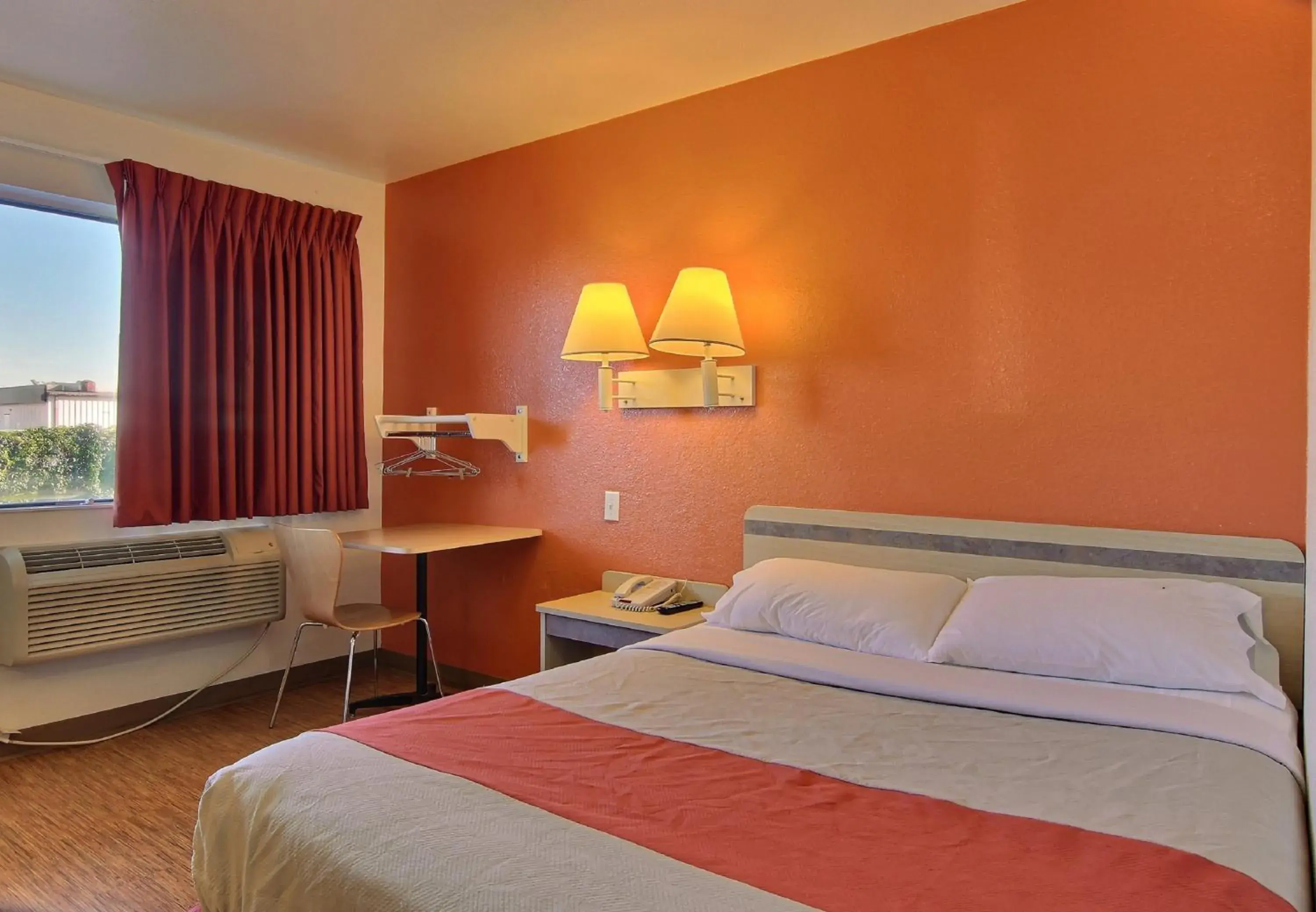 Seating area, Bed in Motel 6 Bismarck, ND