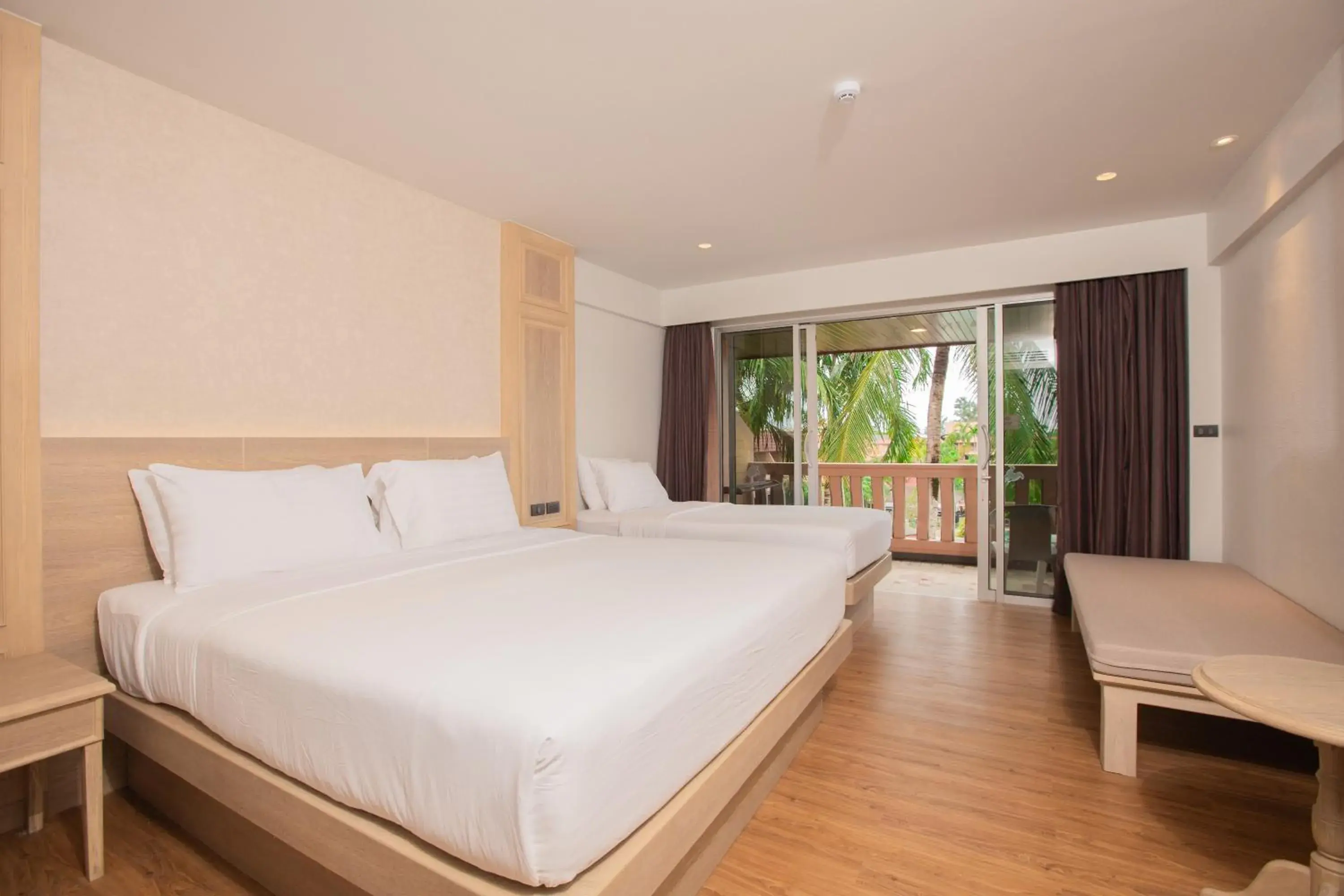 Bed in Phuket Orchid Resort and Spa Bed in Phuket Orchid Resort and Spa