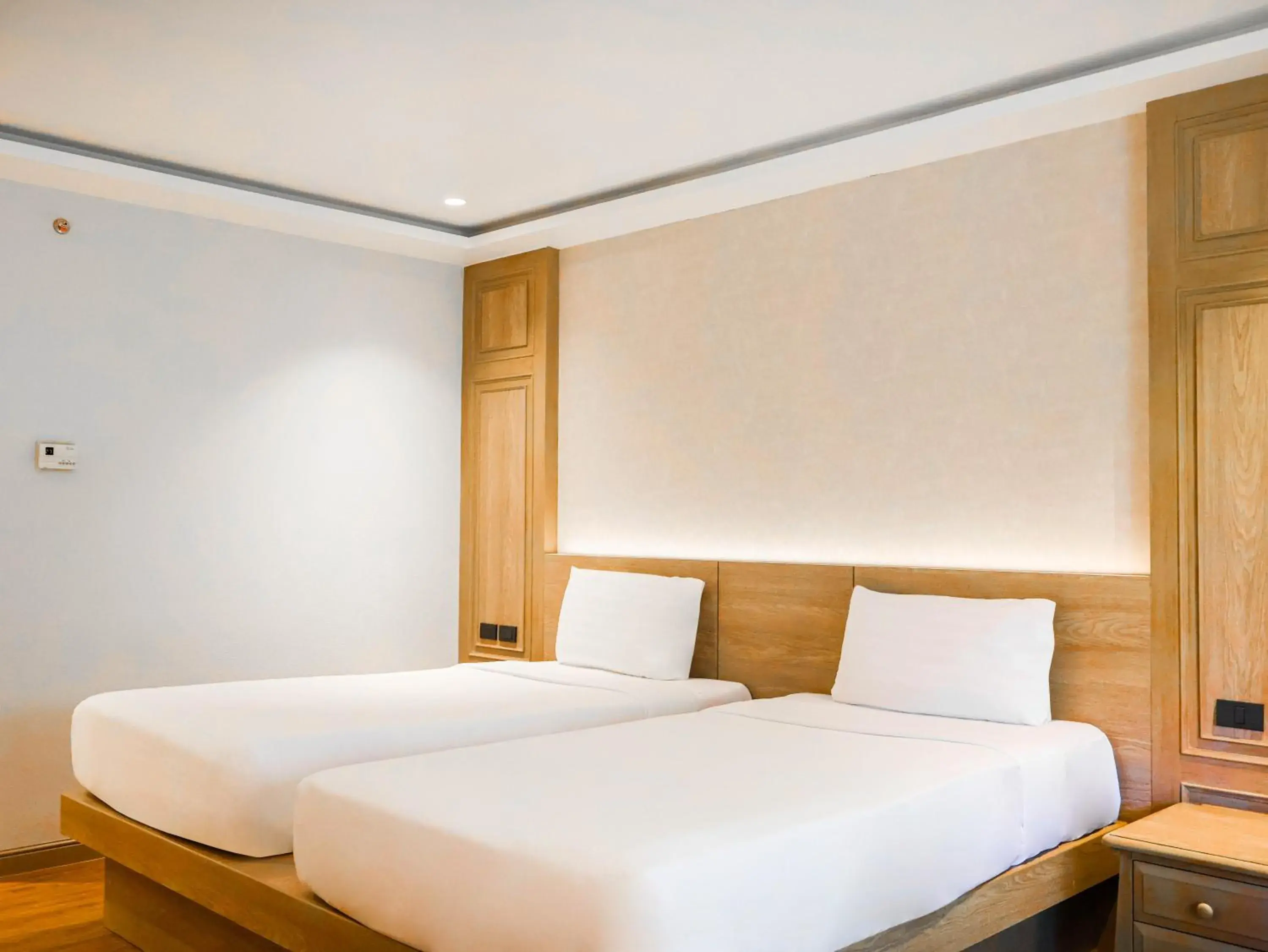 Bed in Phuket Orchid Resort and Spa Bed in Phuket Orchid Resort and Spa