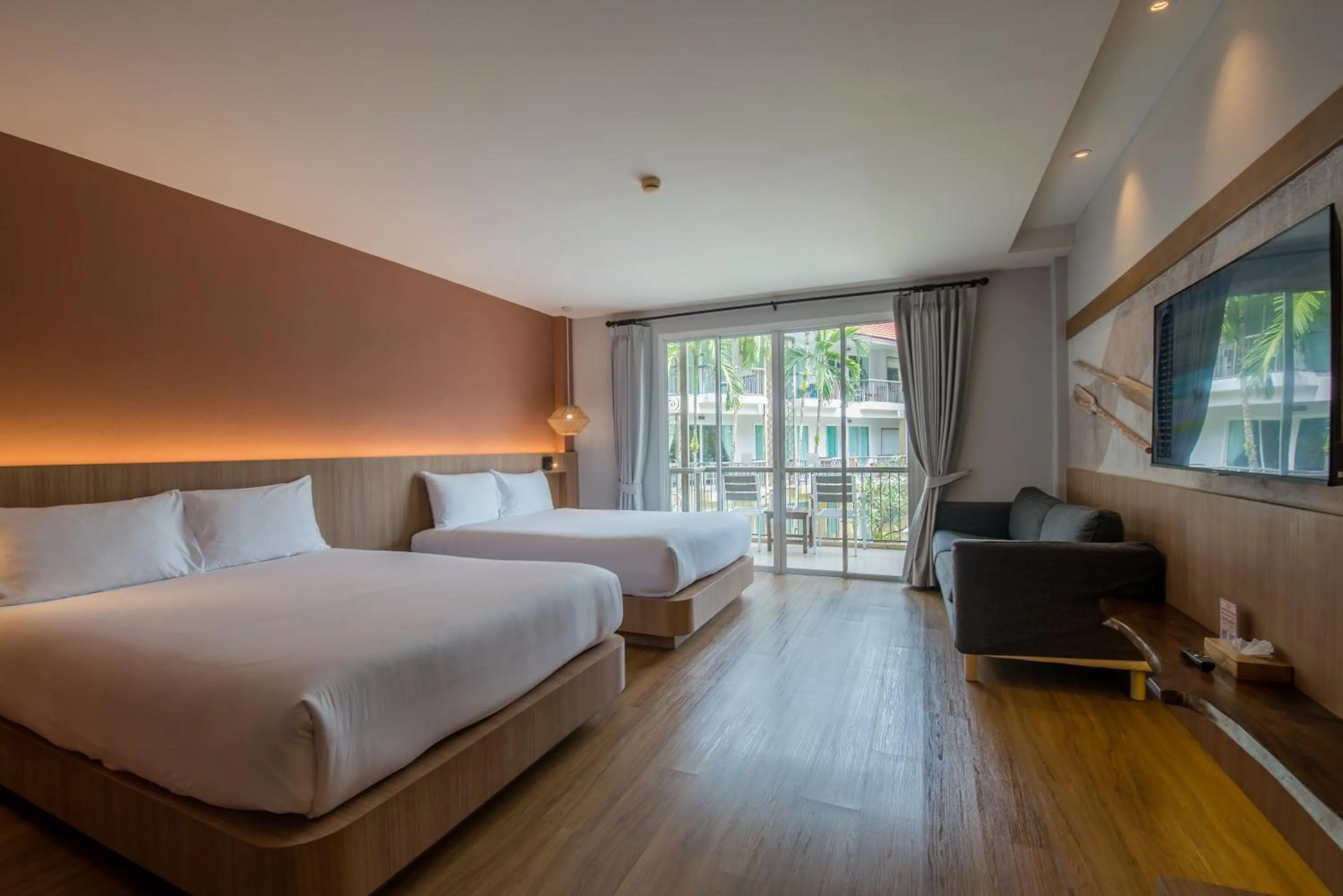 Bed in Baan Karon Resort