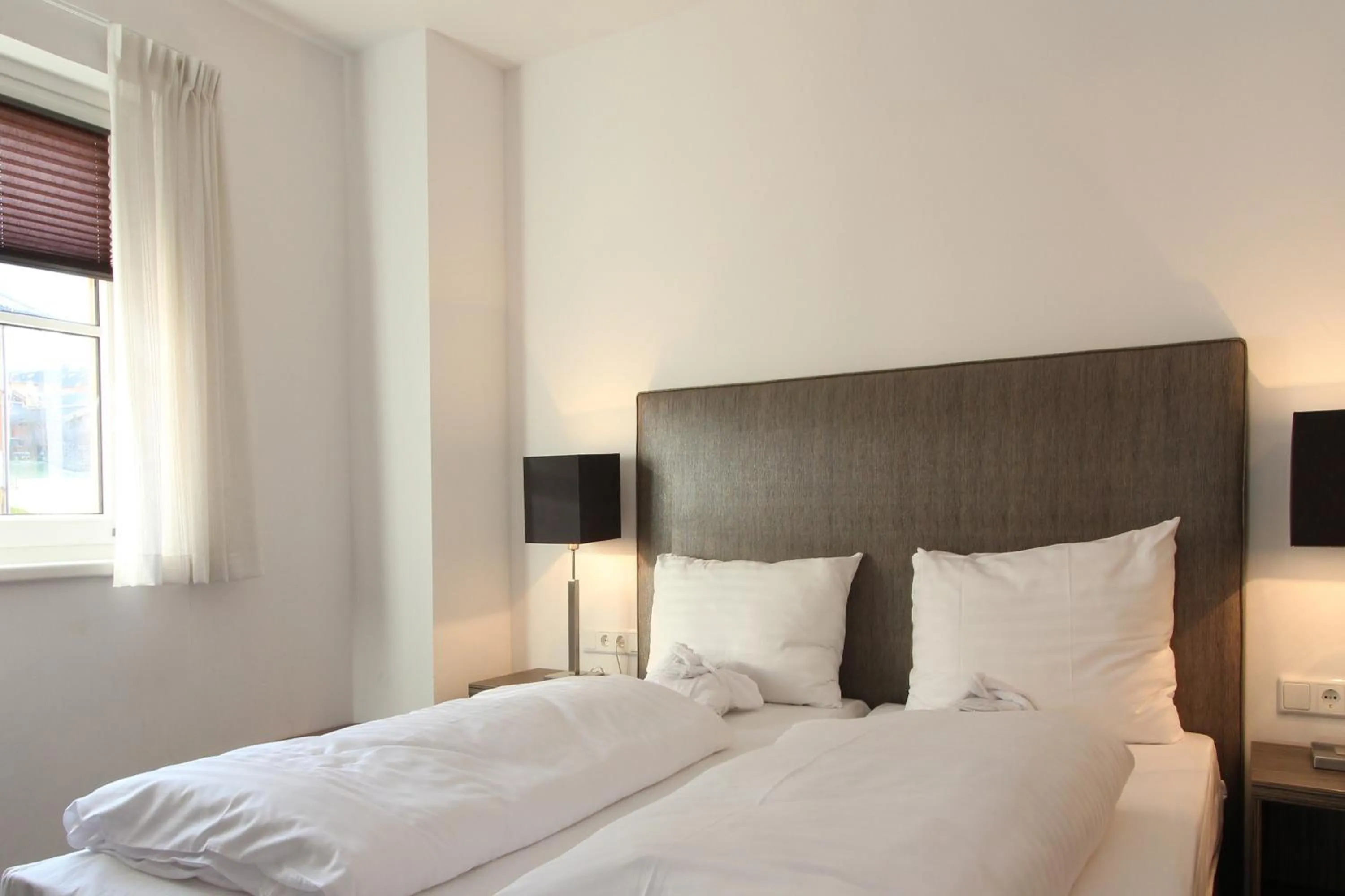 Bed in AvenidA Mountain Resort by Alpin Rentals