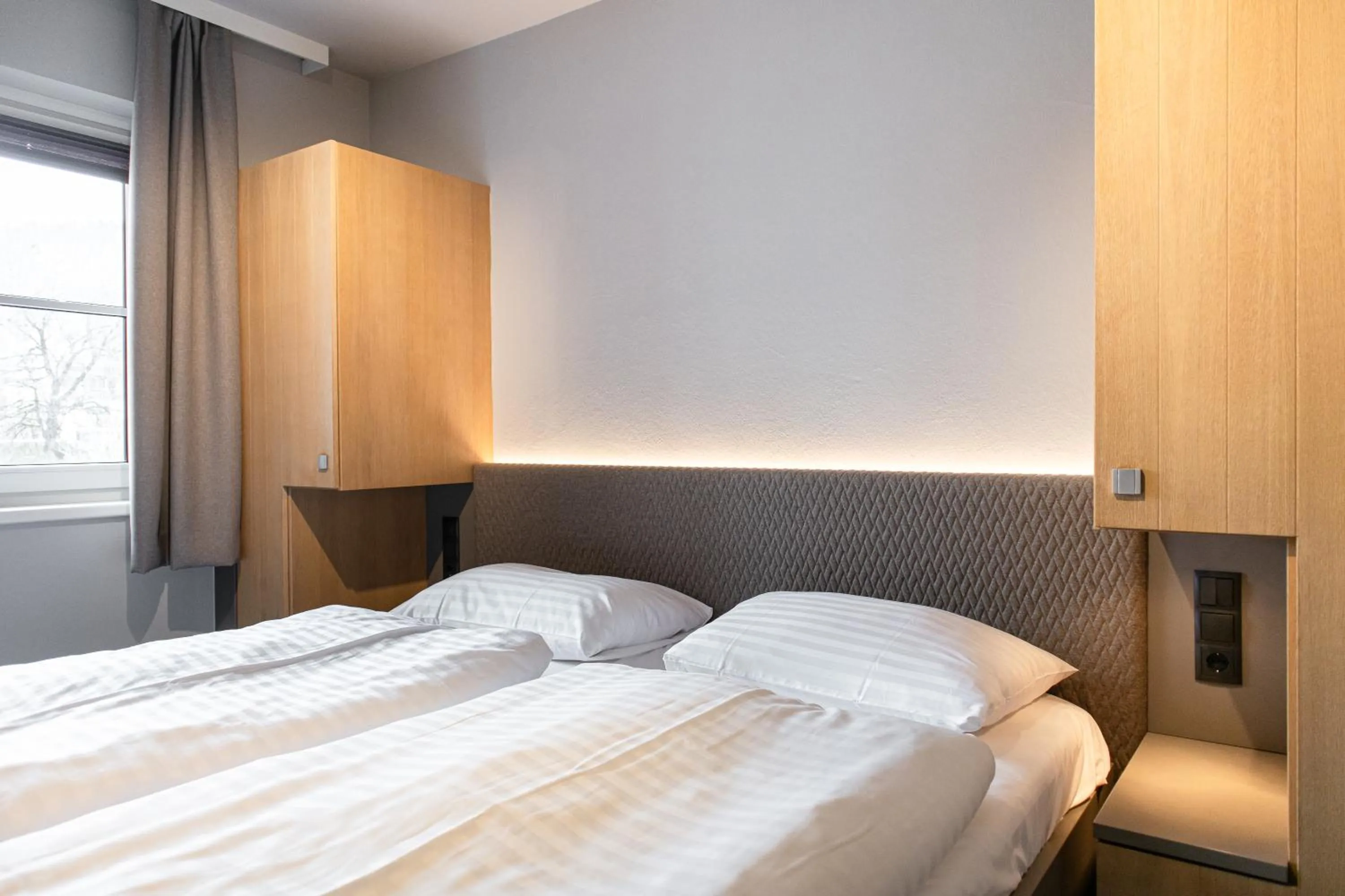 Bed in AvenidA Mountain Resort by Alpin Rentals