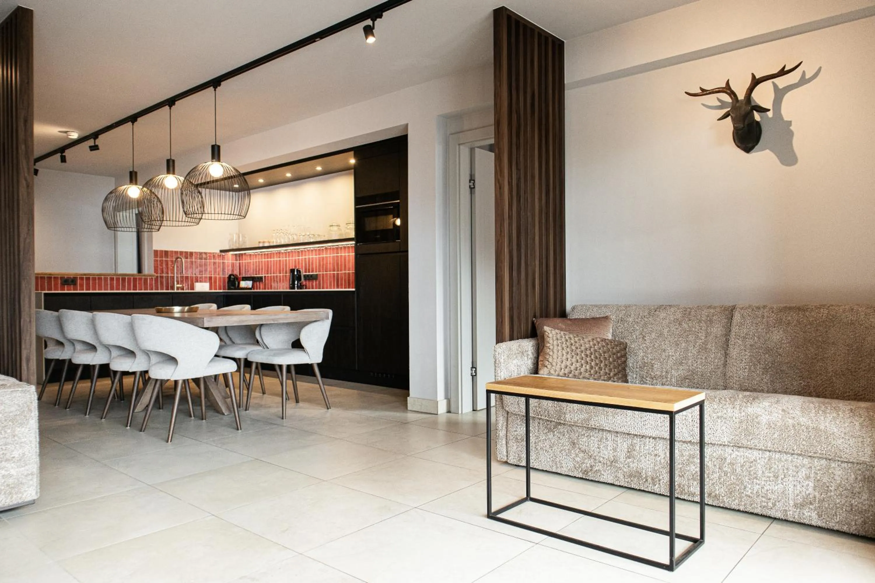 Seating area in AvenidA Mountain Resort by Alpin Rentals