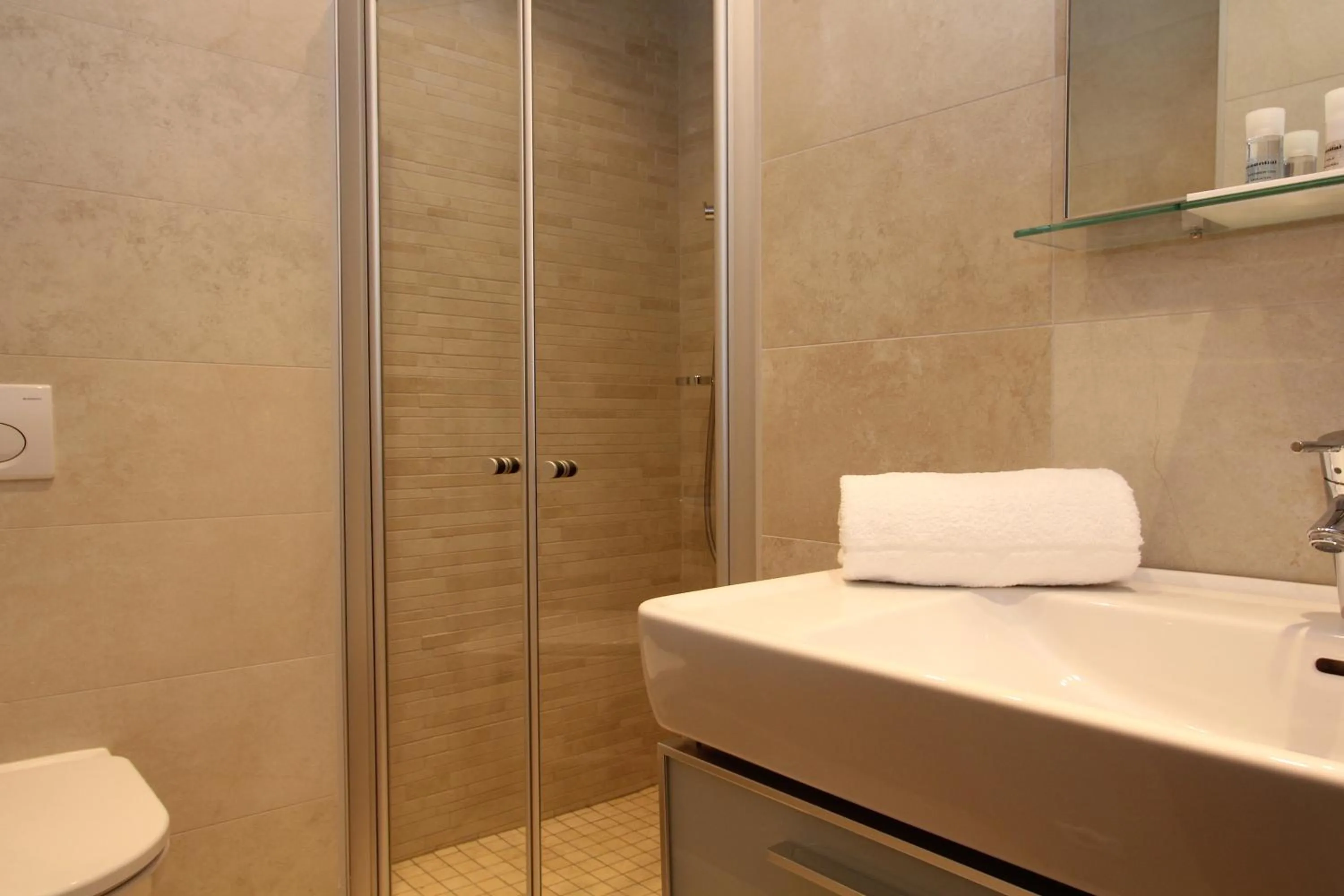 Shower in AvenidA Mountain Resort by Alpin Rentals