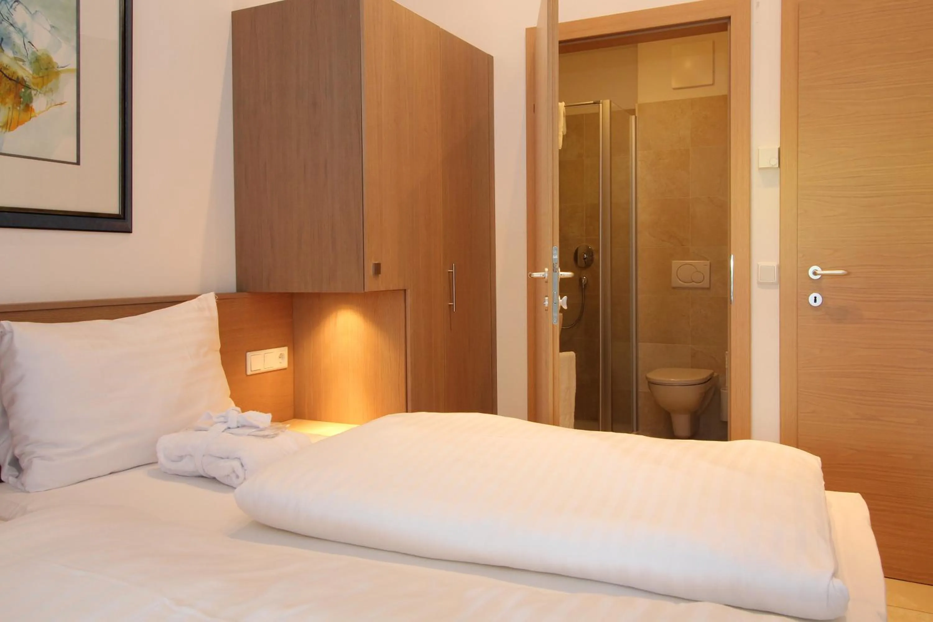 Bed in AvenidA Mountain Resort by Alpin Rentals