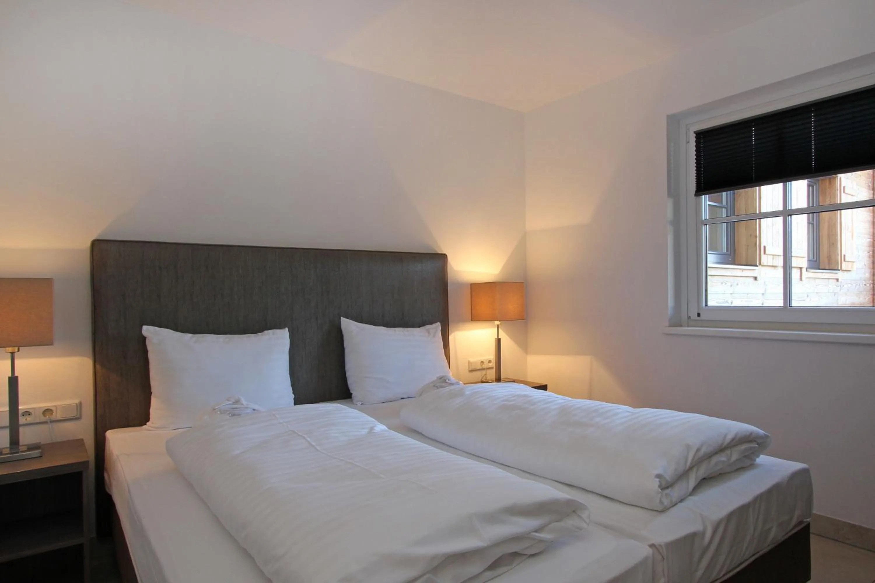 Bed in AvenidA Mountain Resort by Alpin Rentals