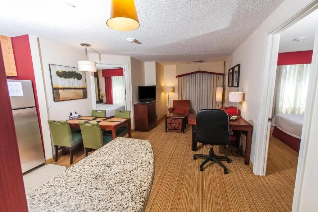 Living room, Bed in Residence Inn Florence