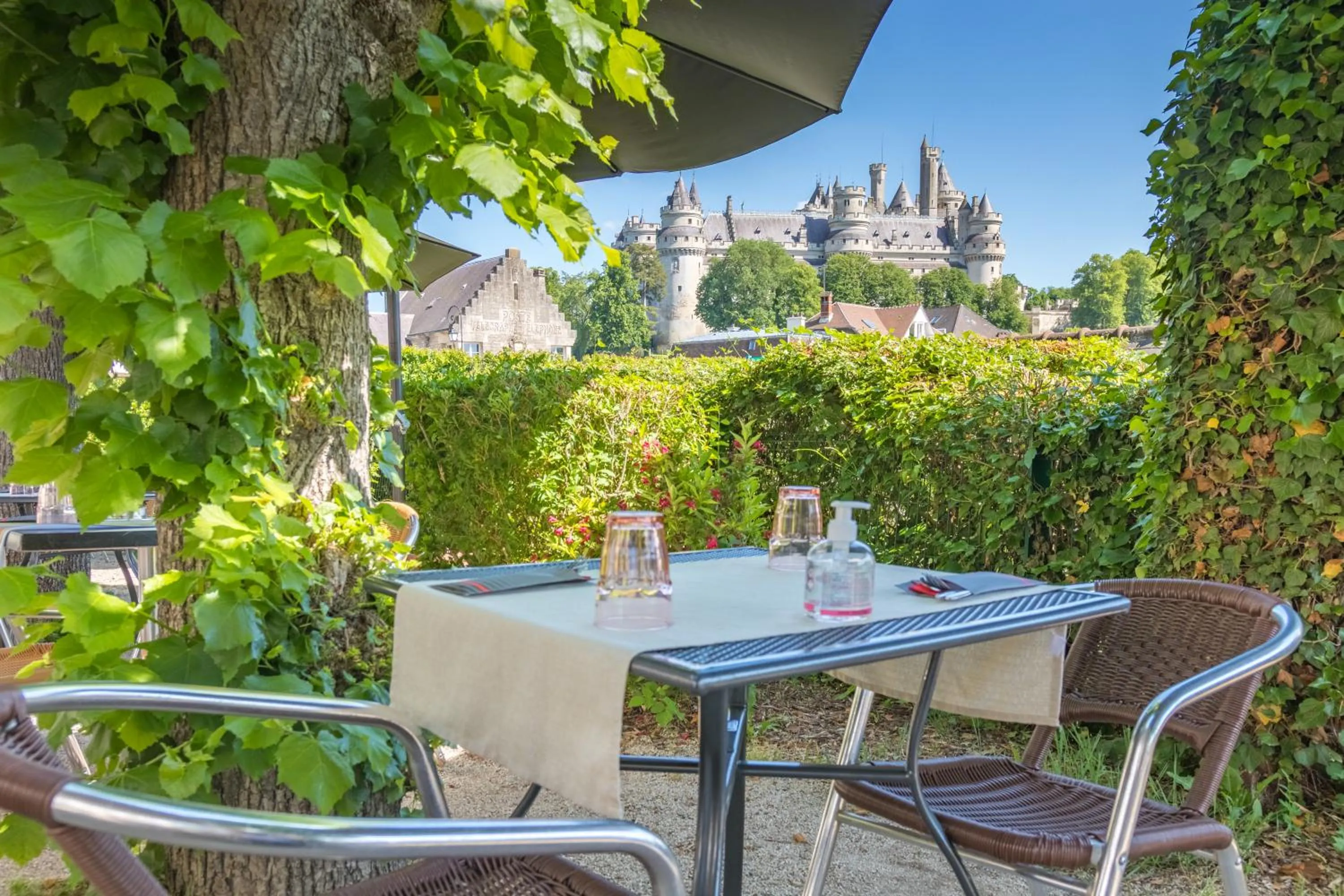 Patio in Logis Hotel Beaudon