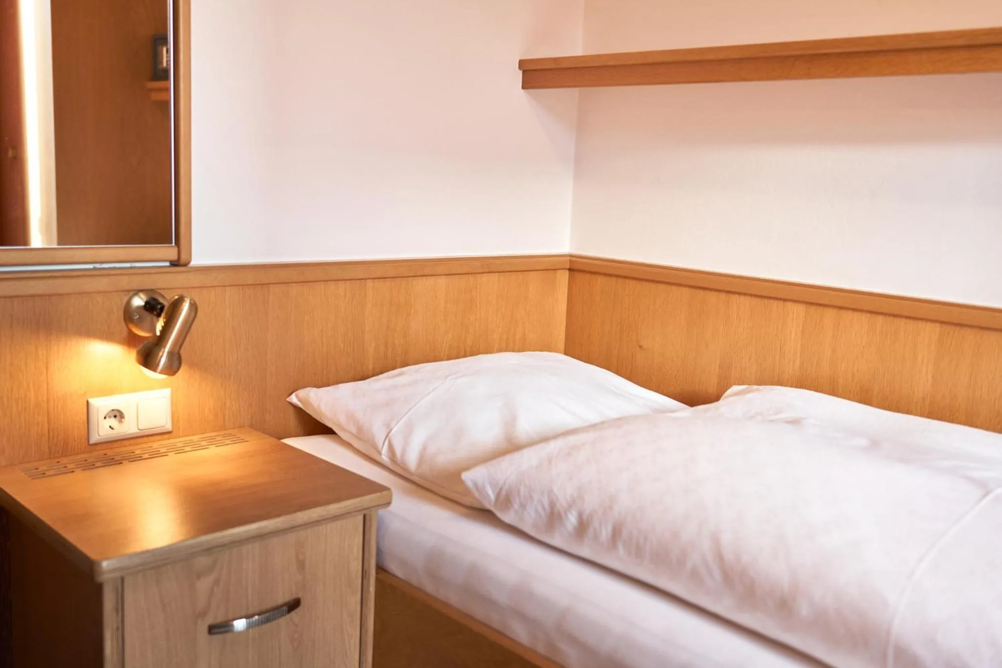 Bed in Pension Vier Jahreszeiten