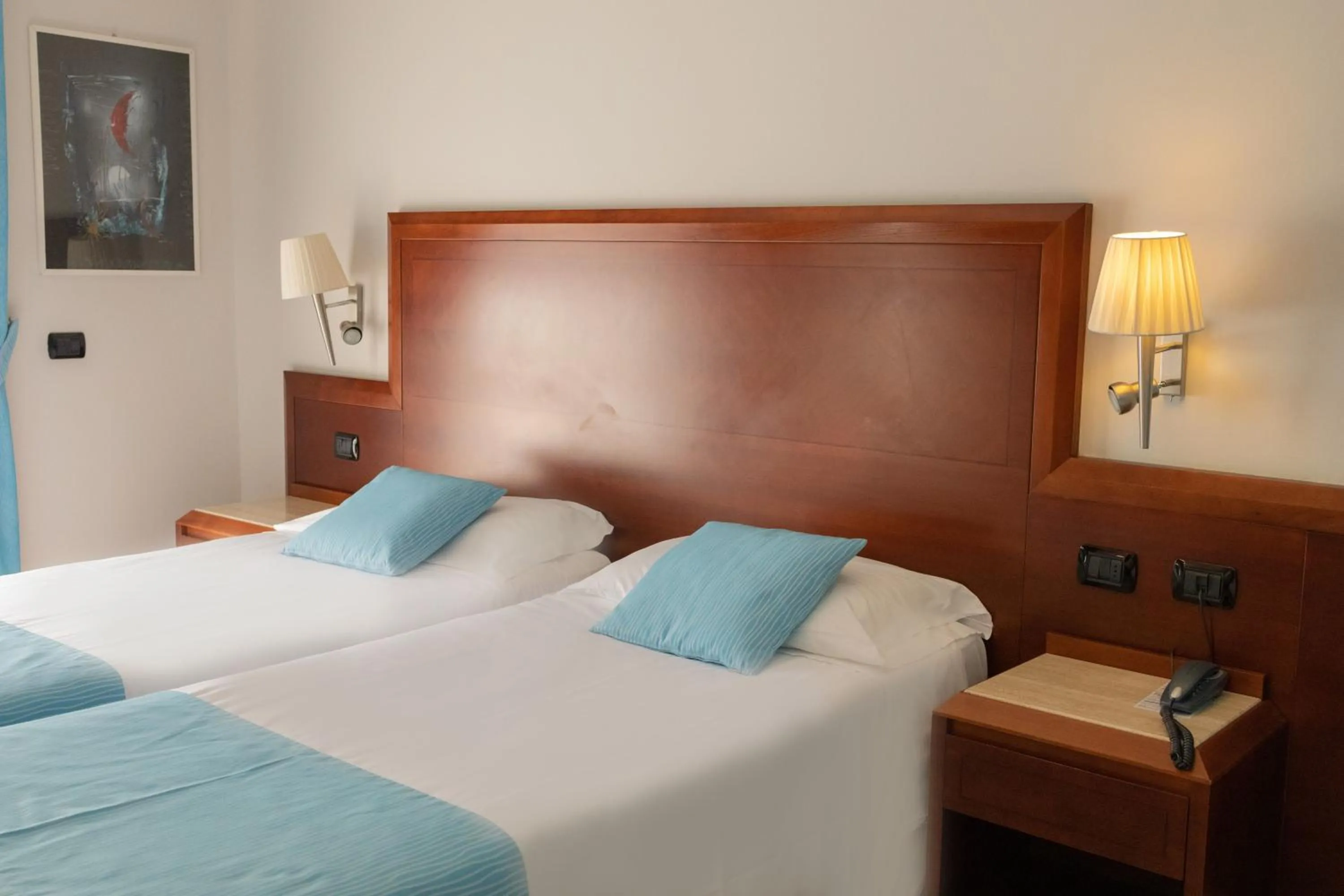 Bed in Hotel Le Palme