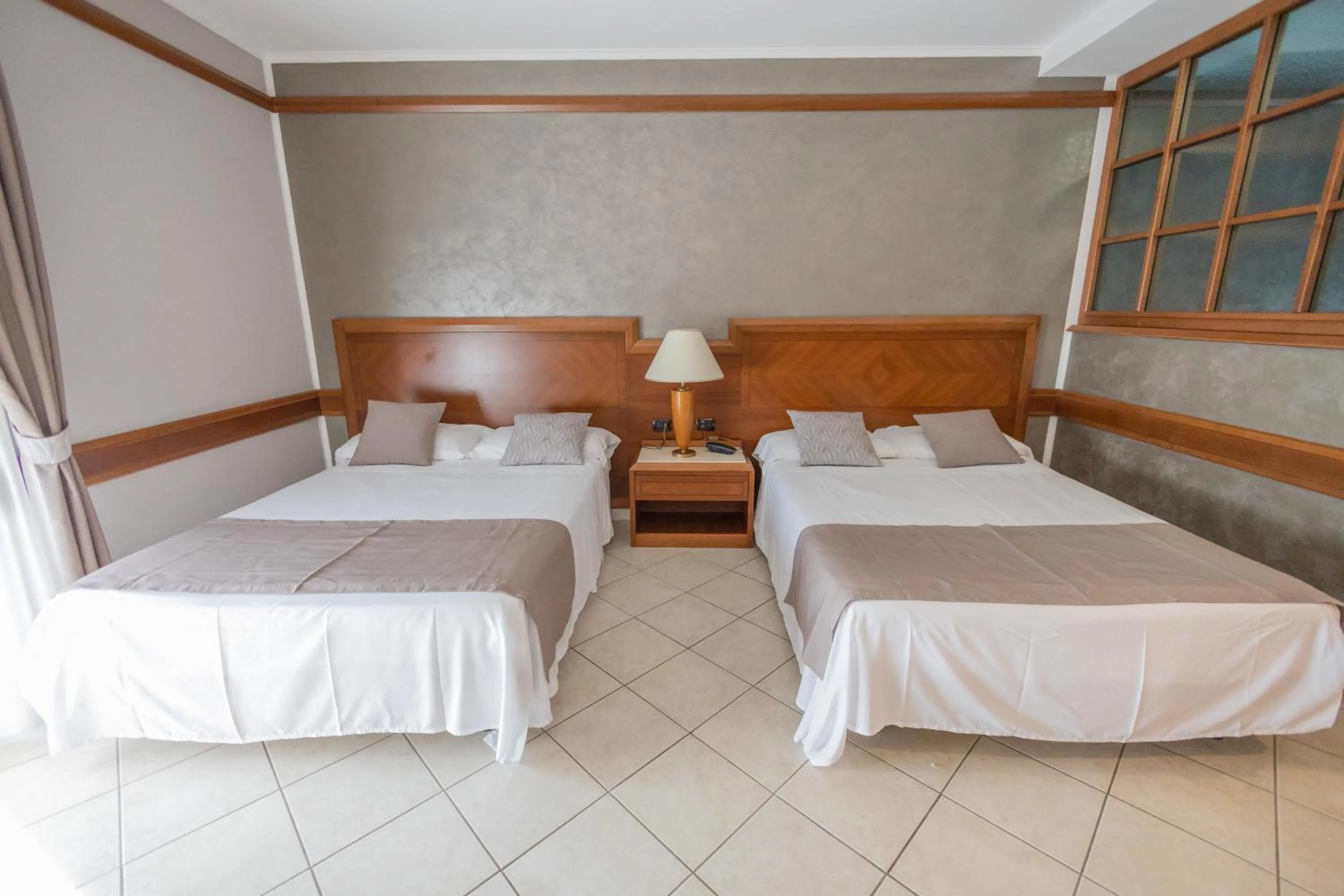 Bed in Hotel Le Palme