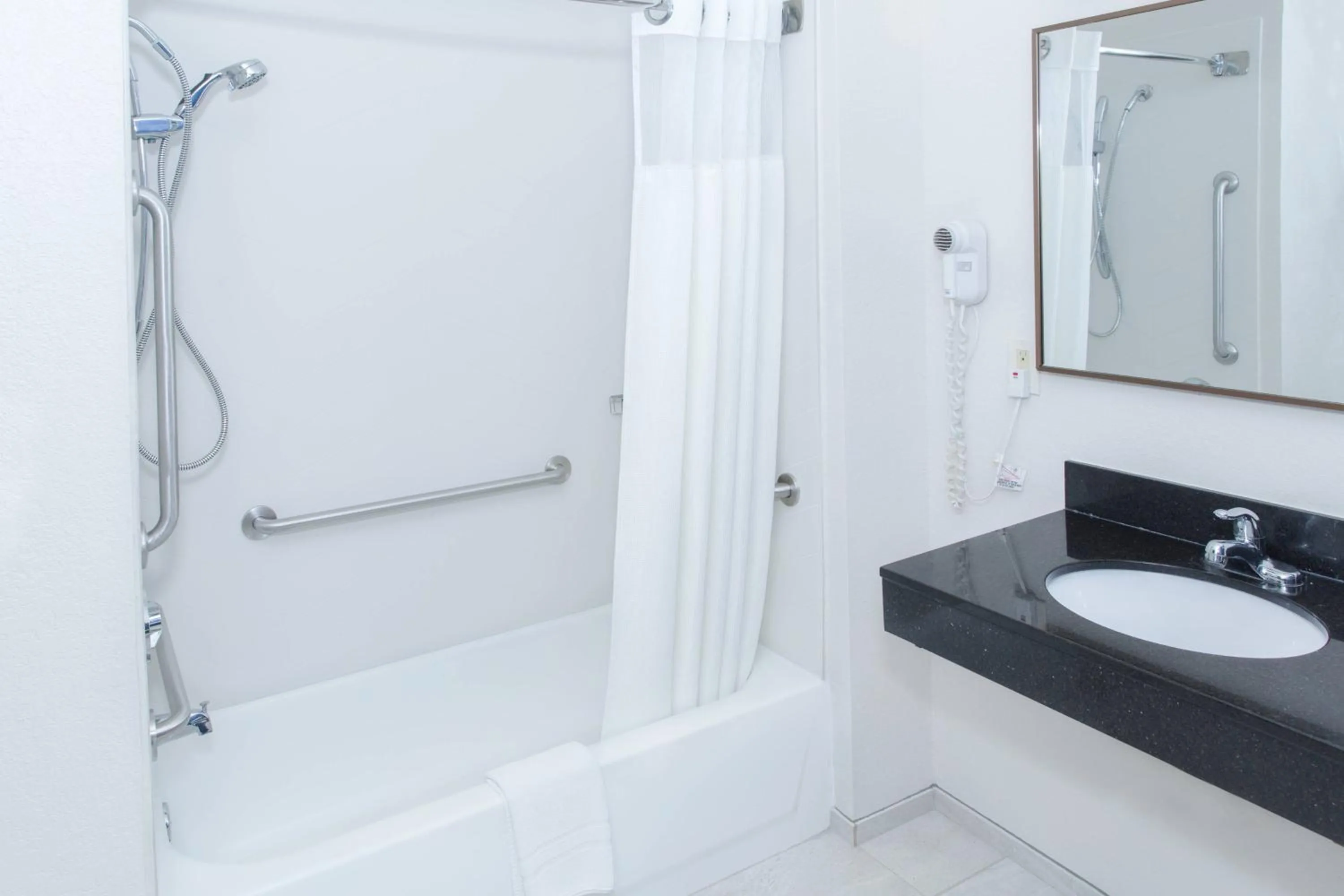 Bathroom in AmericInn by Wyndham Hays