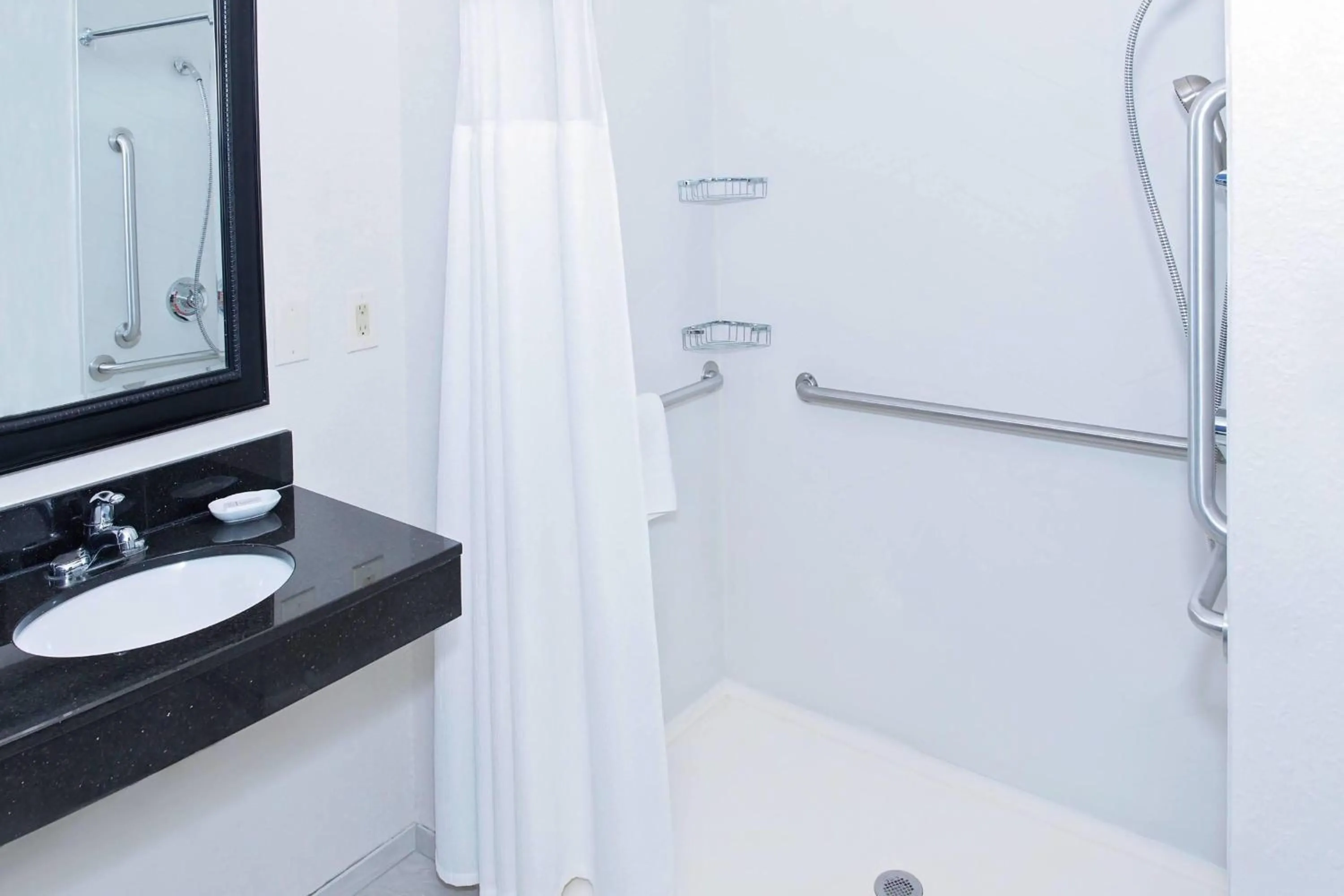 Shower in AmericInn by Wyndham Hays