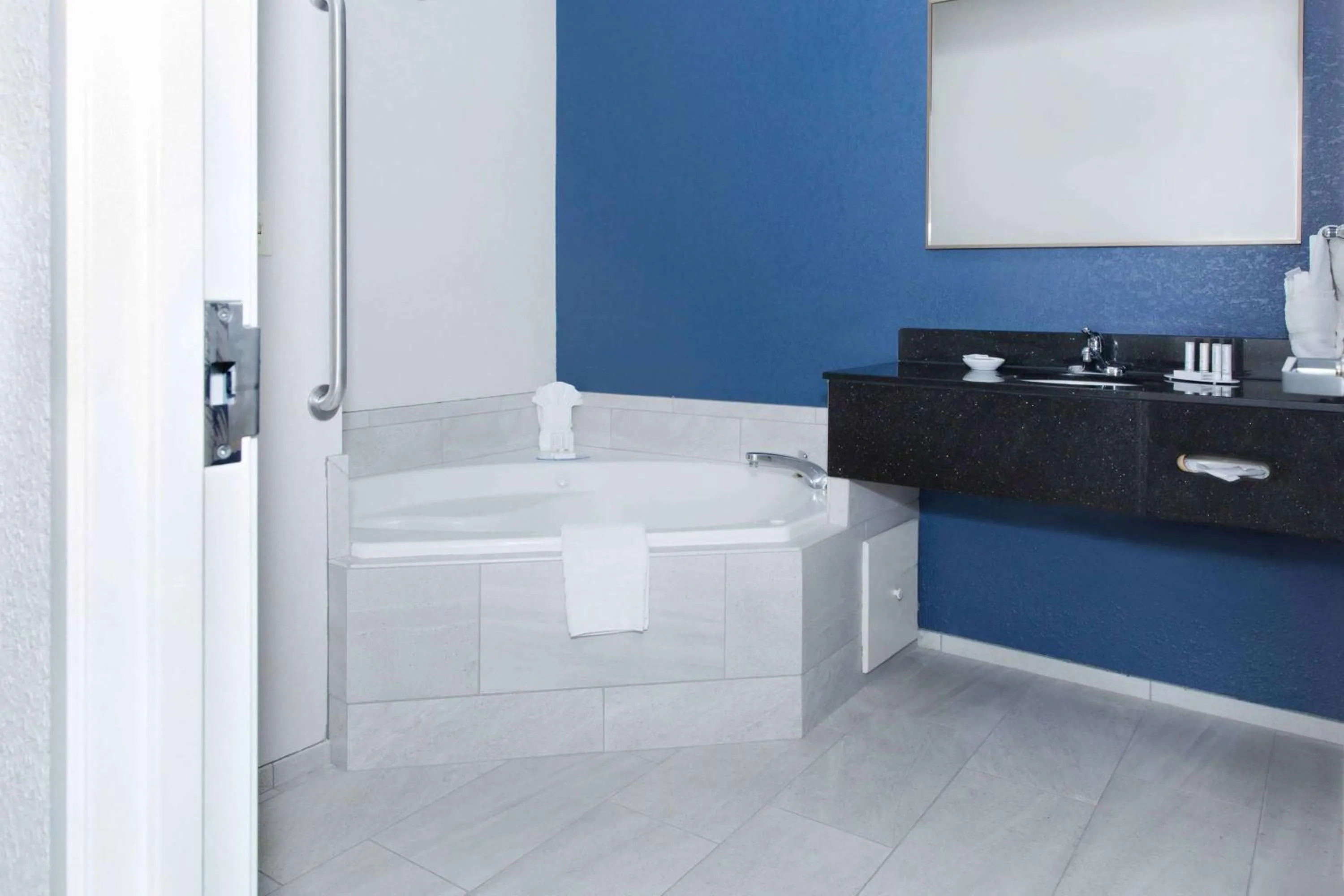 Bathroom in AmericInn by Wyndham Hays