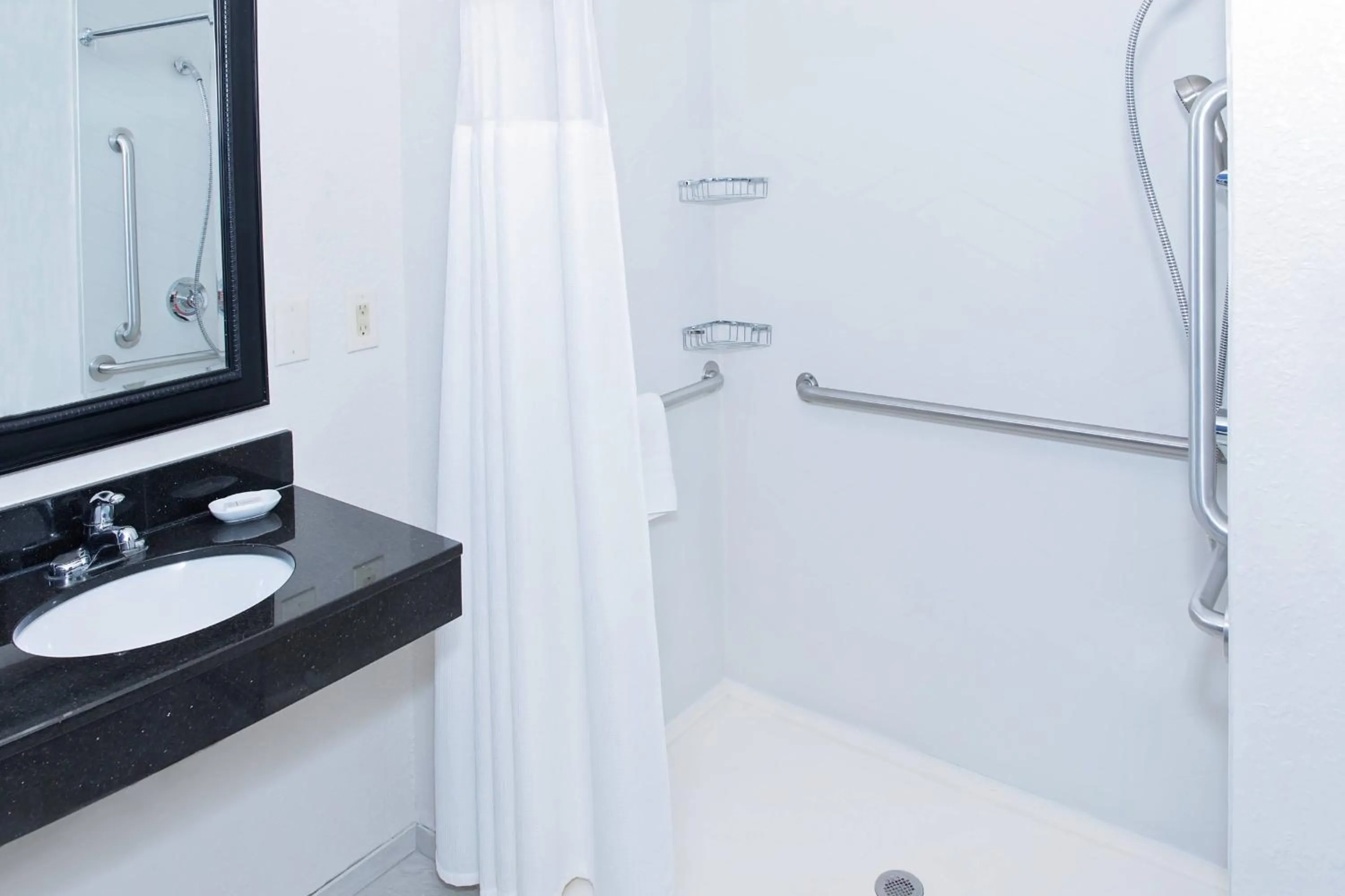 Bathroom in AmericInn by Wyndham Hays