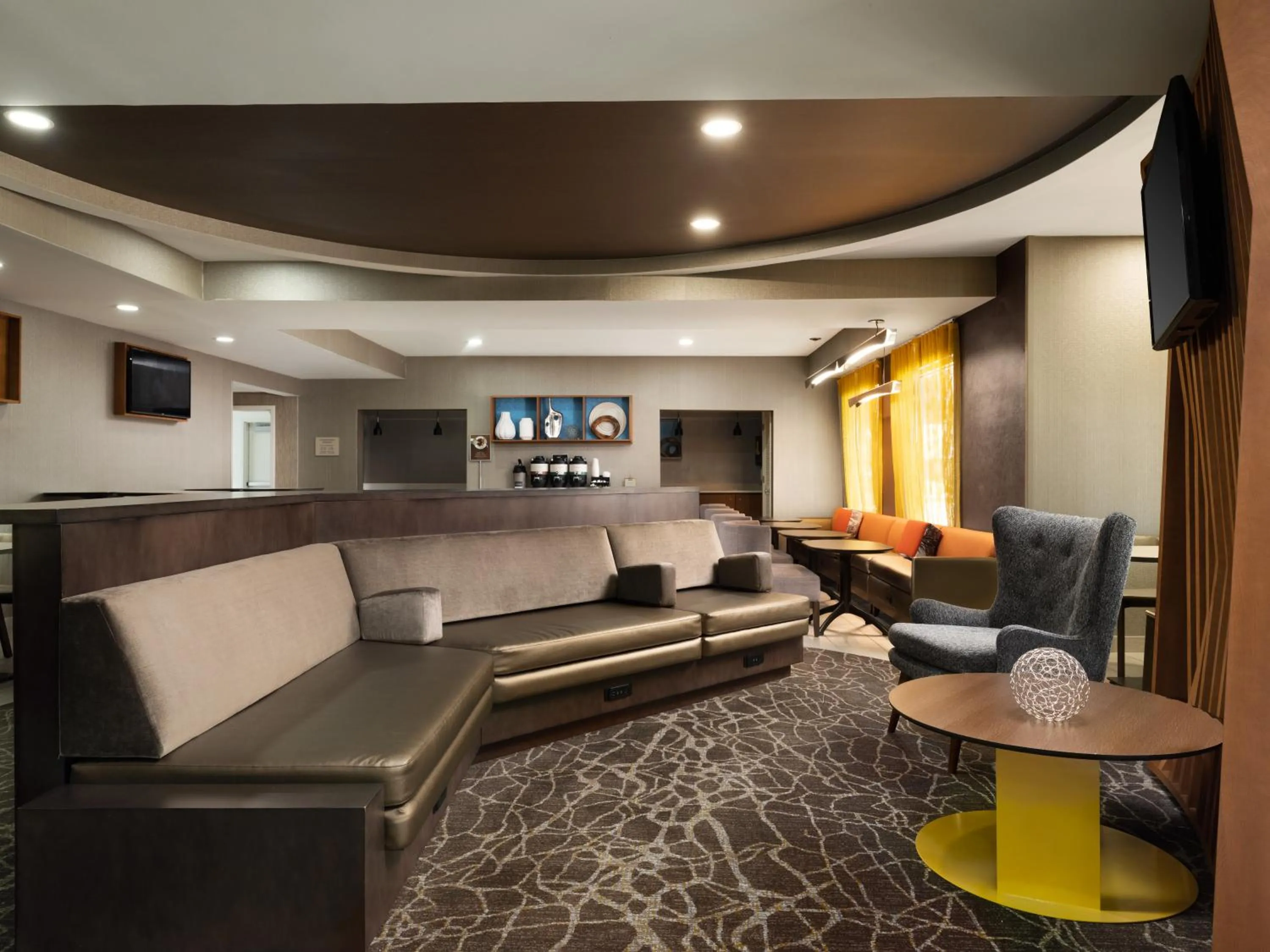 Communal lounge/ TV room in SpringHill Suites Kansas City Overland Park