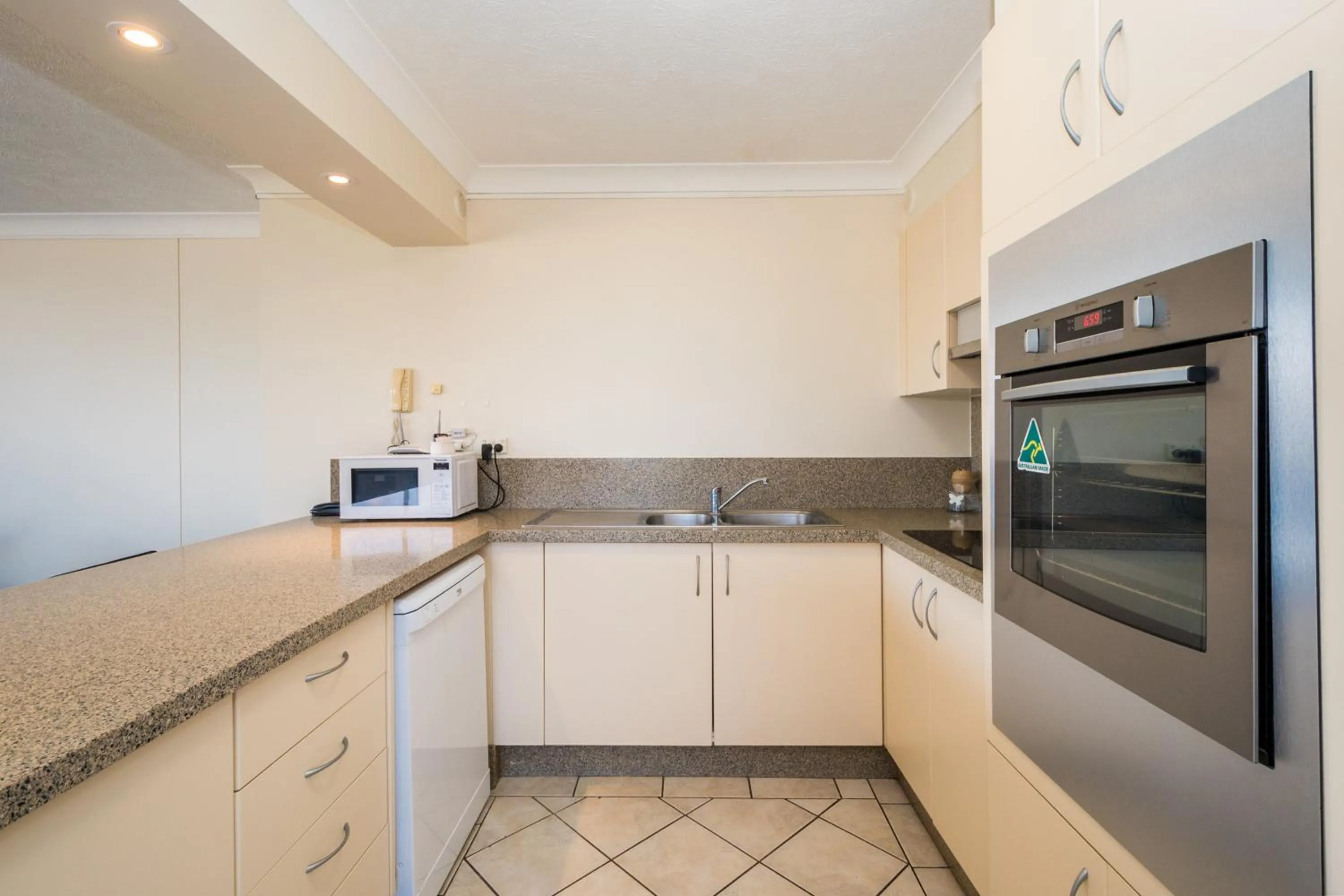 Kitchen or kitchenette in Breakers North Absolute Beachfront Apartments - Official