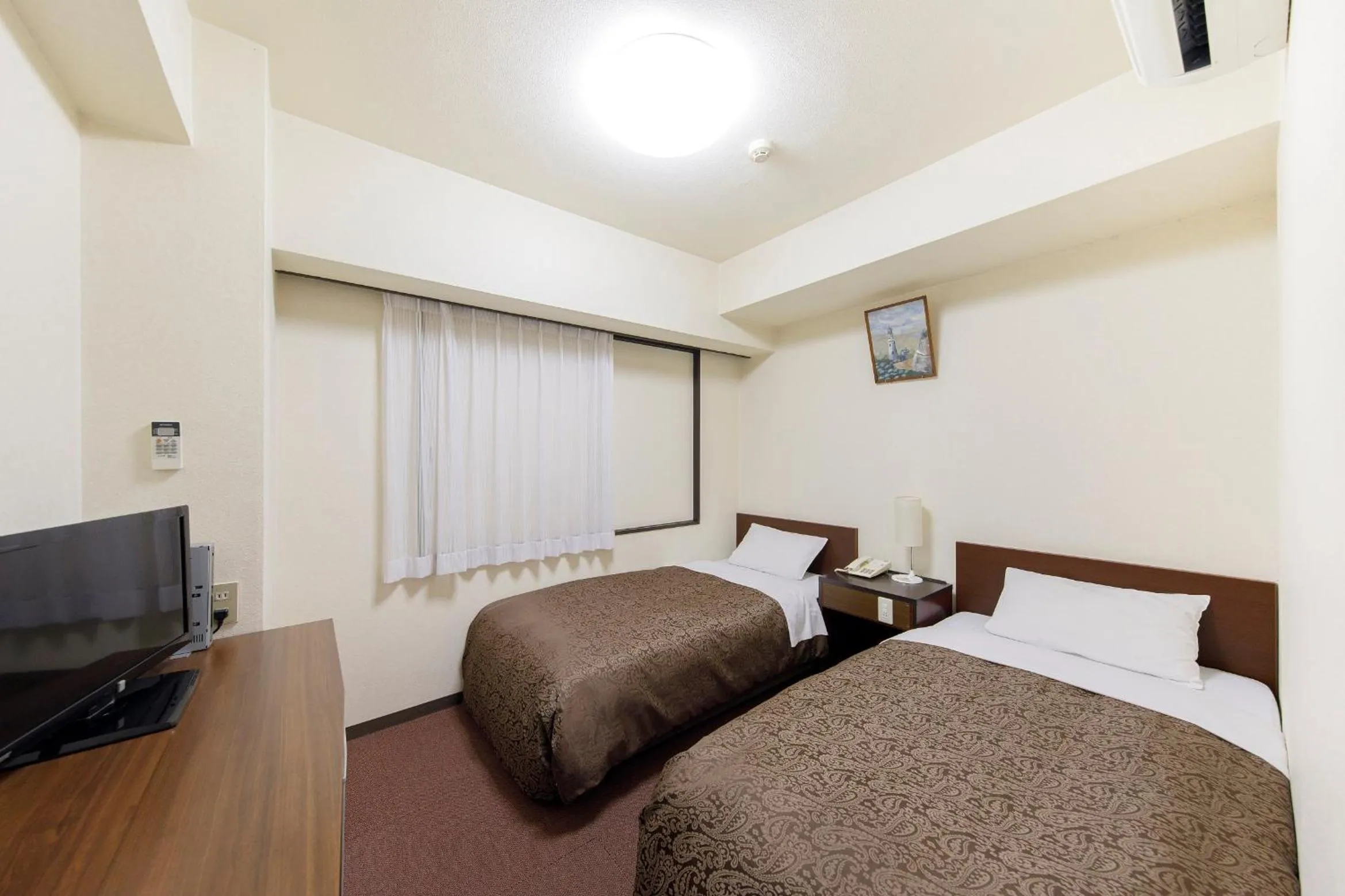 Bed in Dai-ni Sunny Stone Hotel