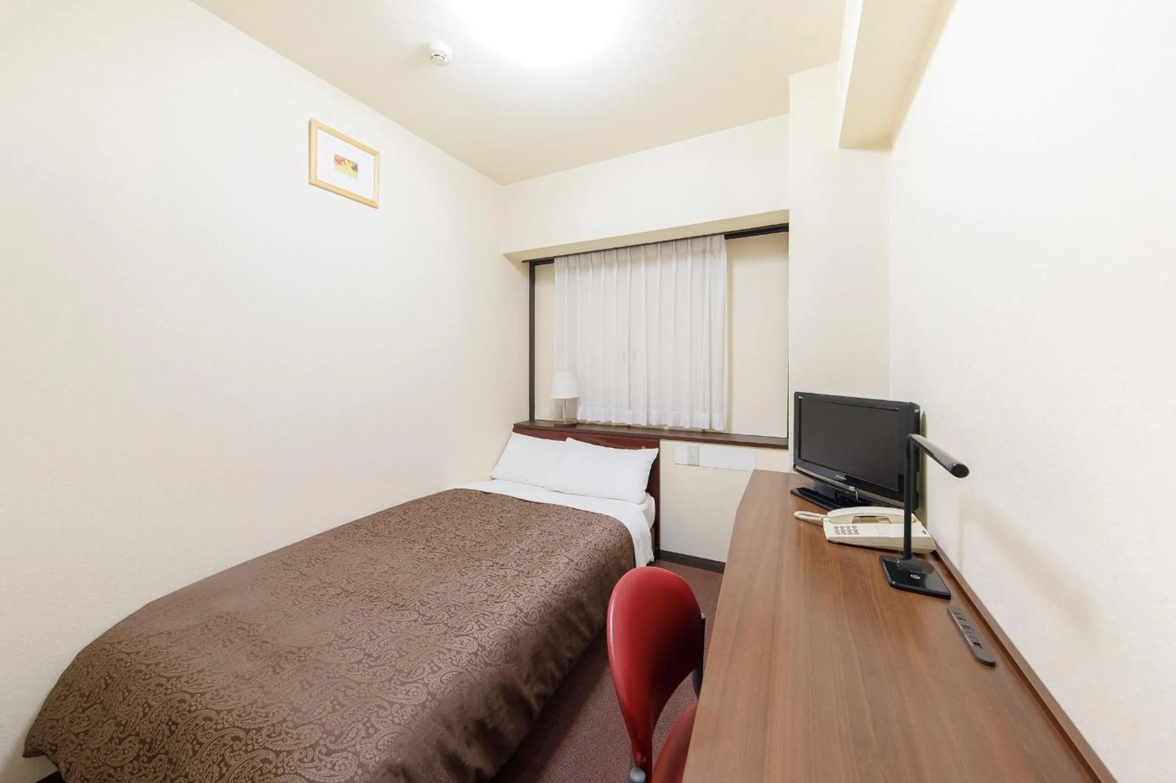 Bed in Dai-ni Sunny Stone Hotel