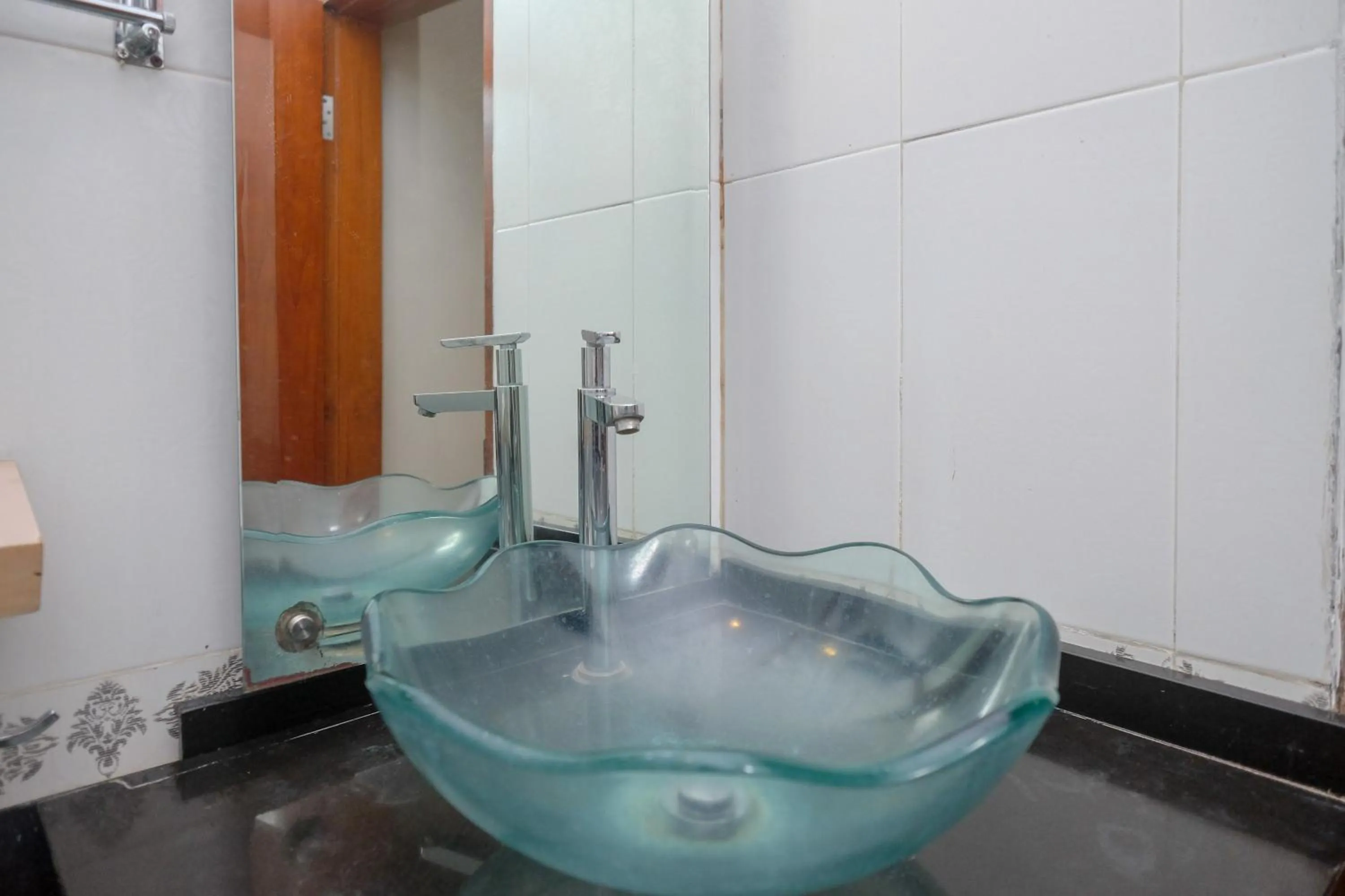 Bathroom in Urbanview Omah Eka Santi by RedDoorz