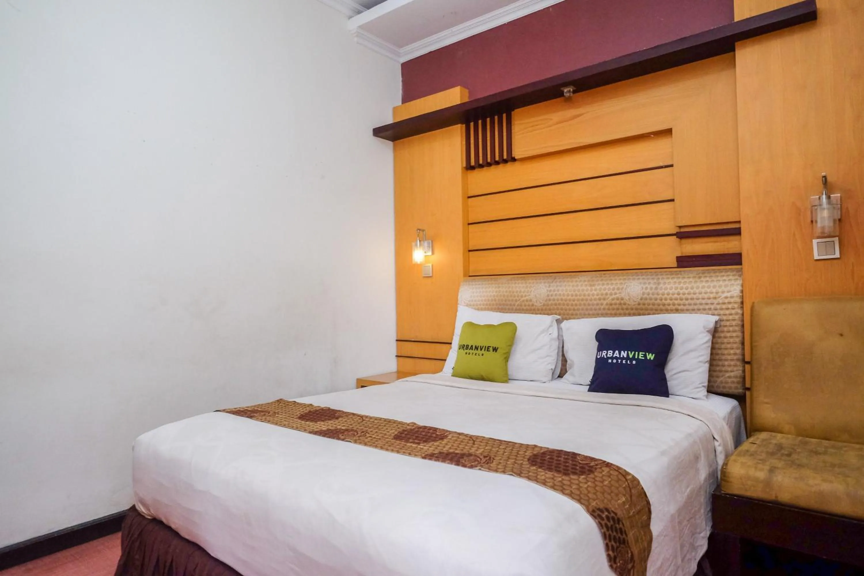 Bedroom, Bed in Urbanview Omah Eka Santi by RedDoorz