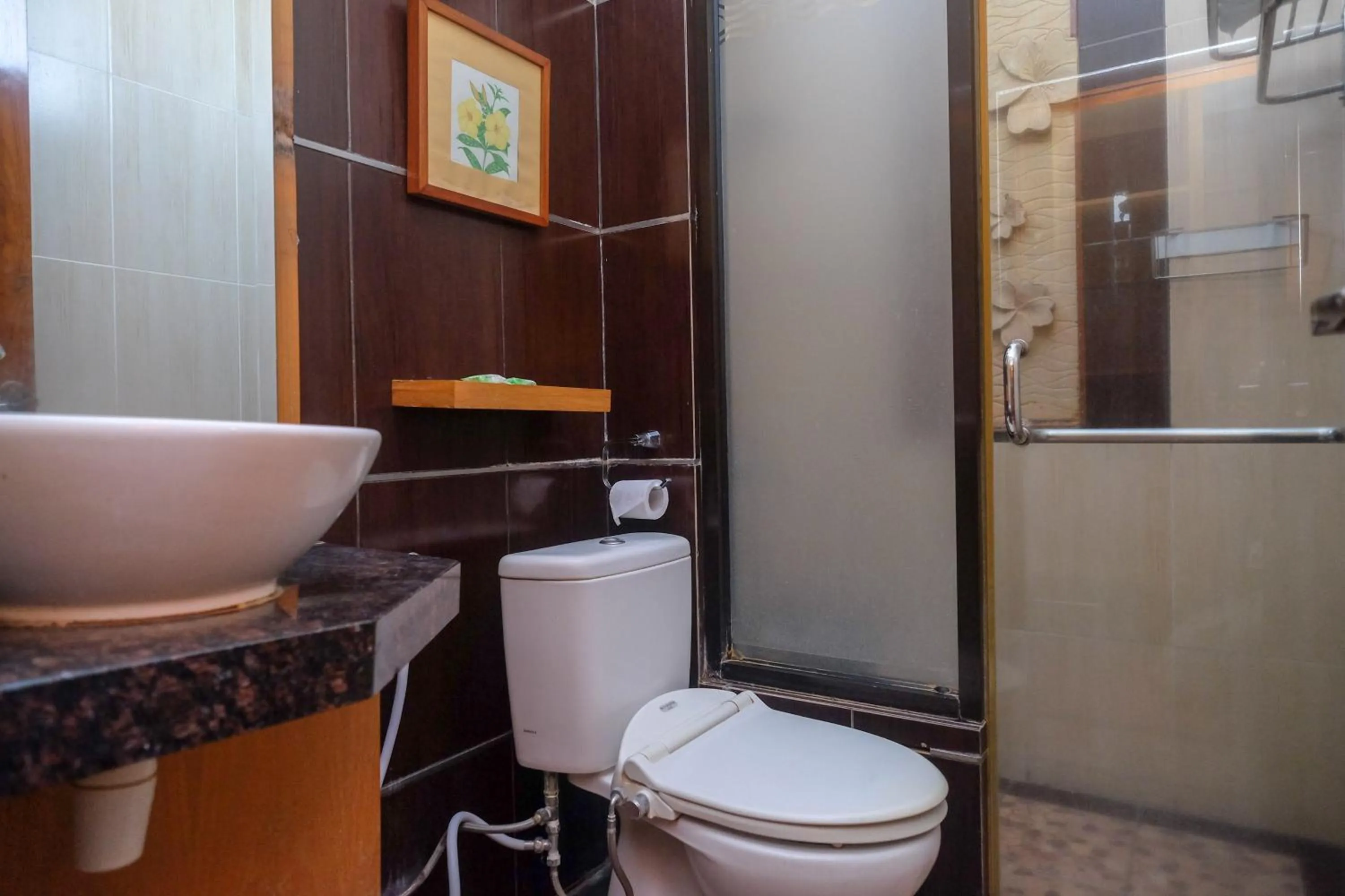 Bathroom in Urbanview Omah Eka Santi by RedDoorz