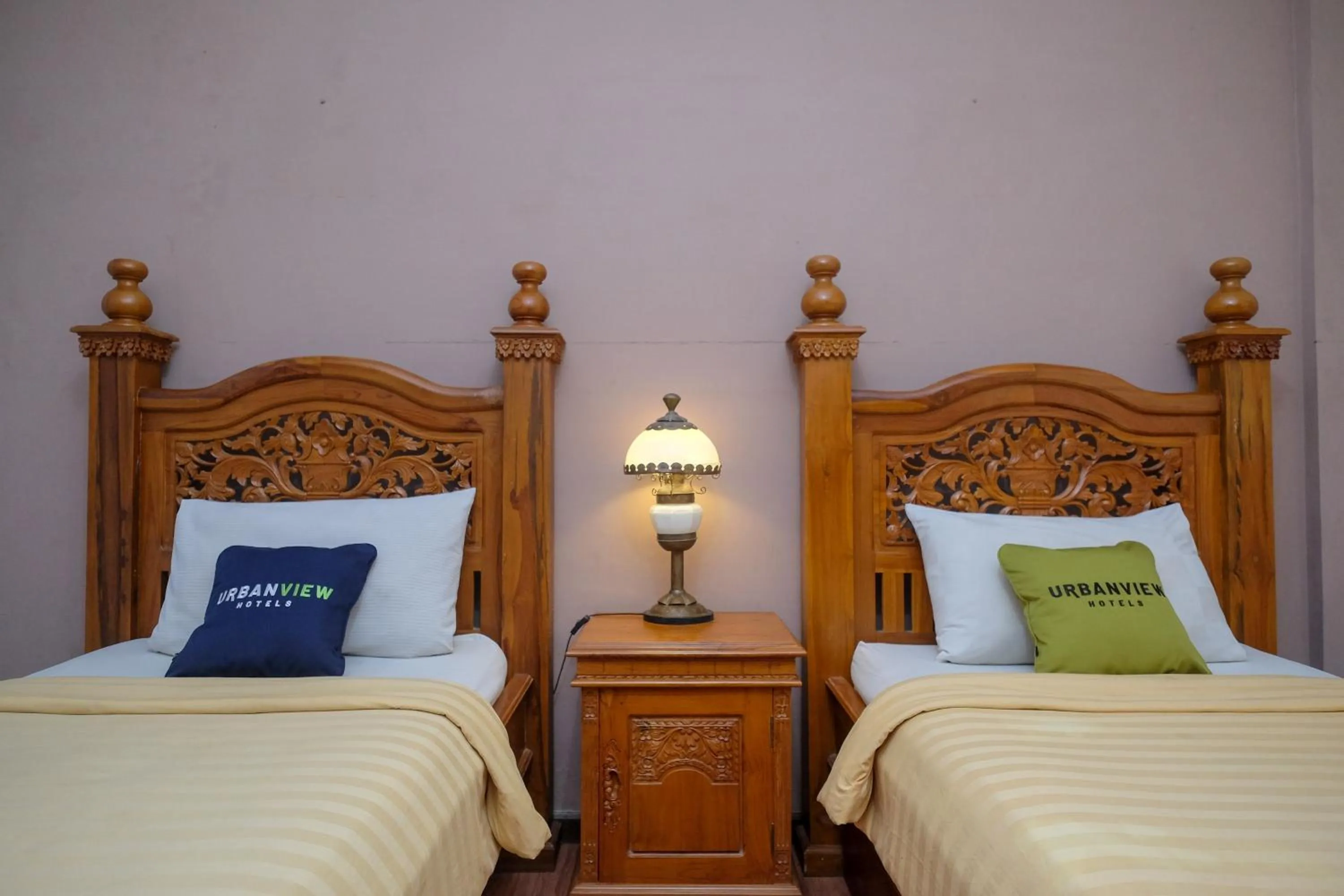 Bedroom, Bed in Urbanview Omah Eka Santi by RedDoorz