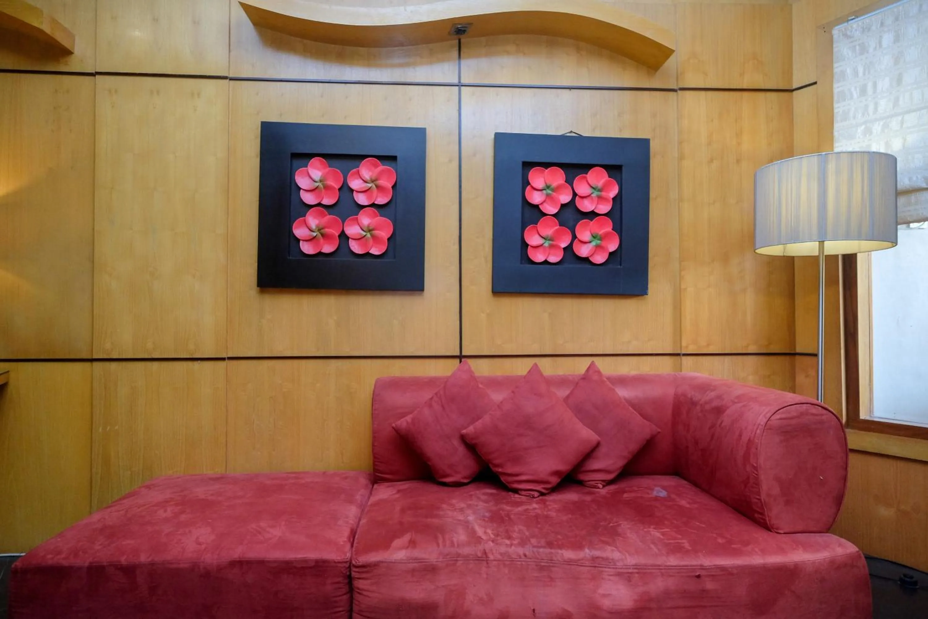 Seating area in Urbanview Omah Eka Santi by RedDoorz