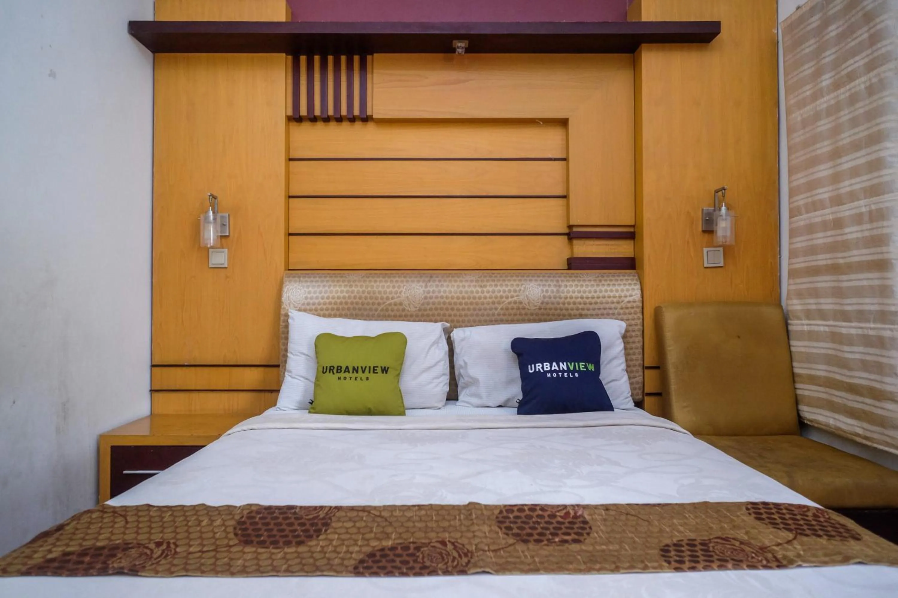 Bedroom, Bed in Urbanview Omah Eka Santi by RedDoorz