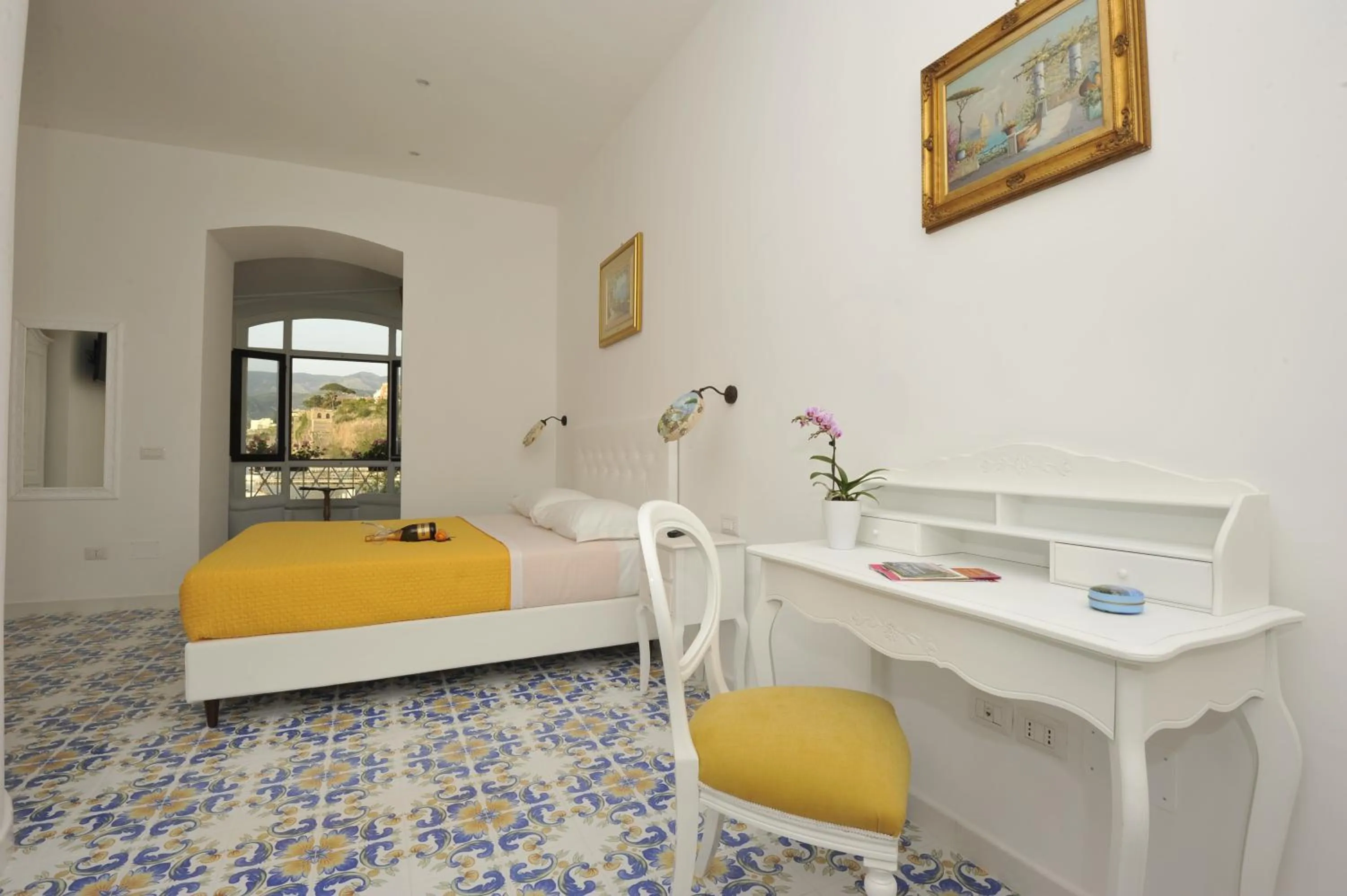 Bed in Surriento Suites