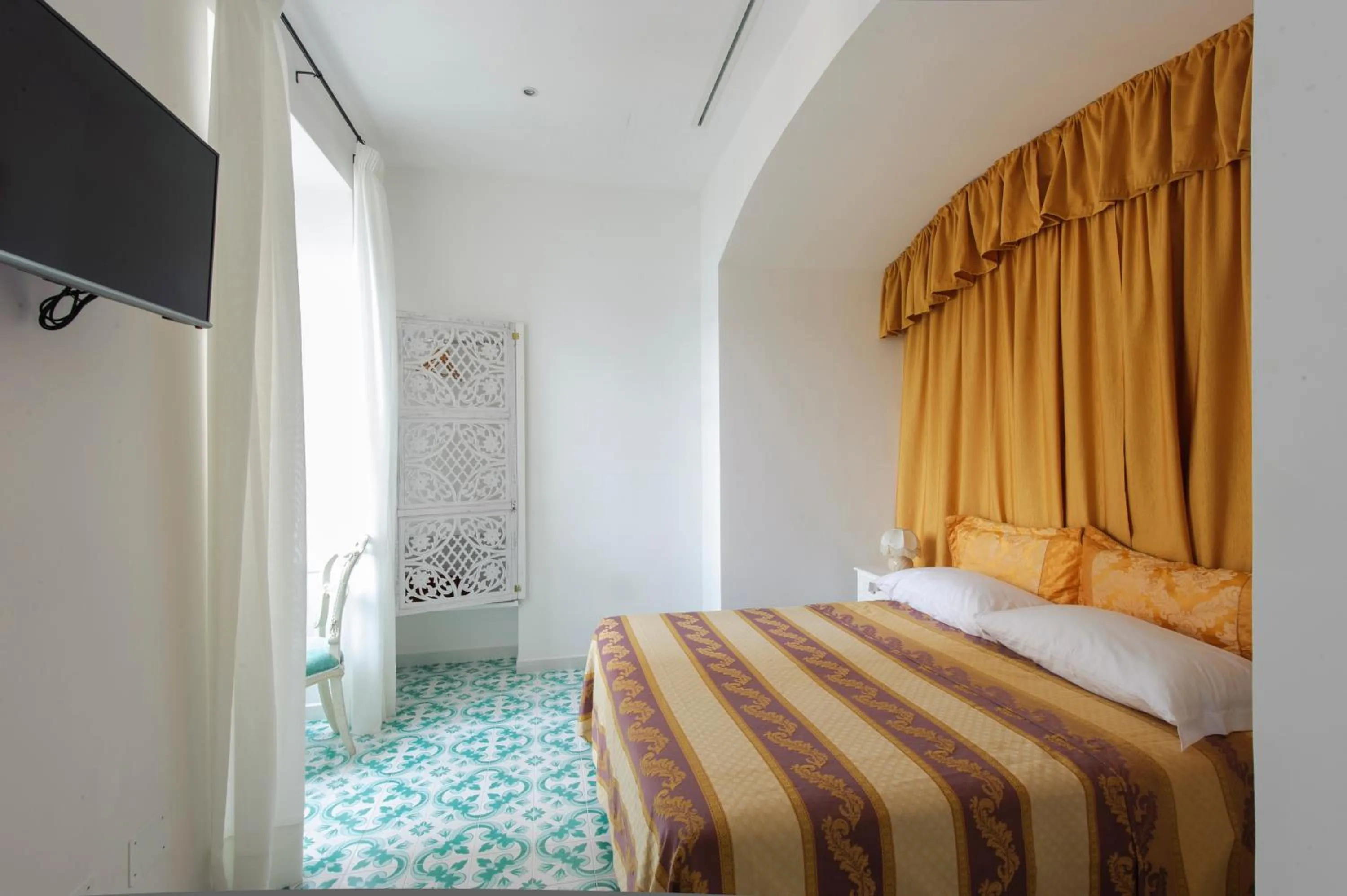 Bed in Surriento Suites