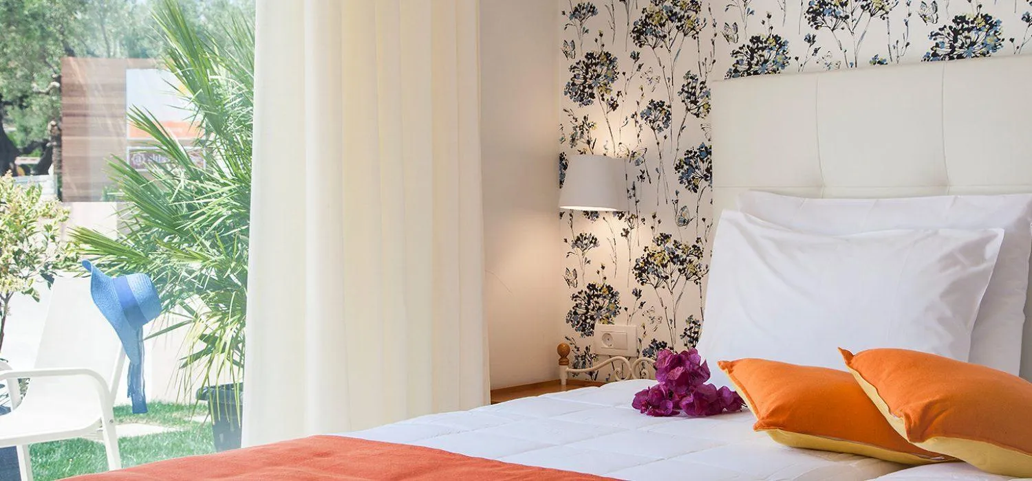 Inner courtyard view, Bed in Althea Village - Family Hotel