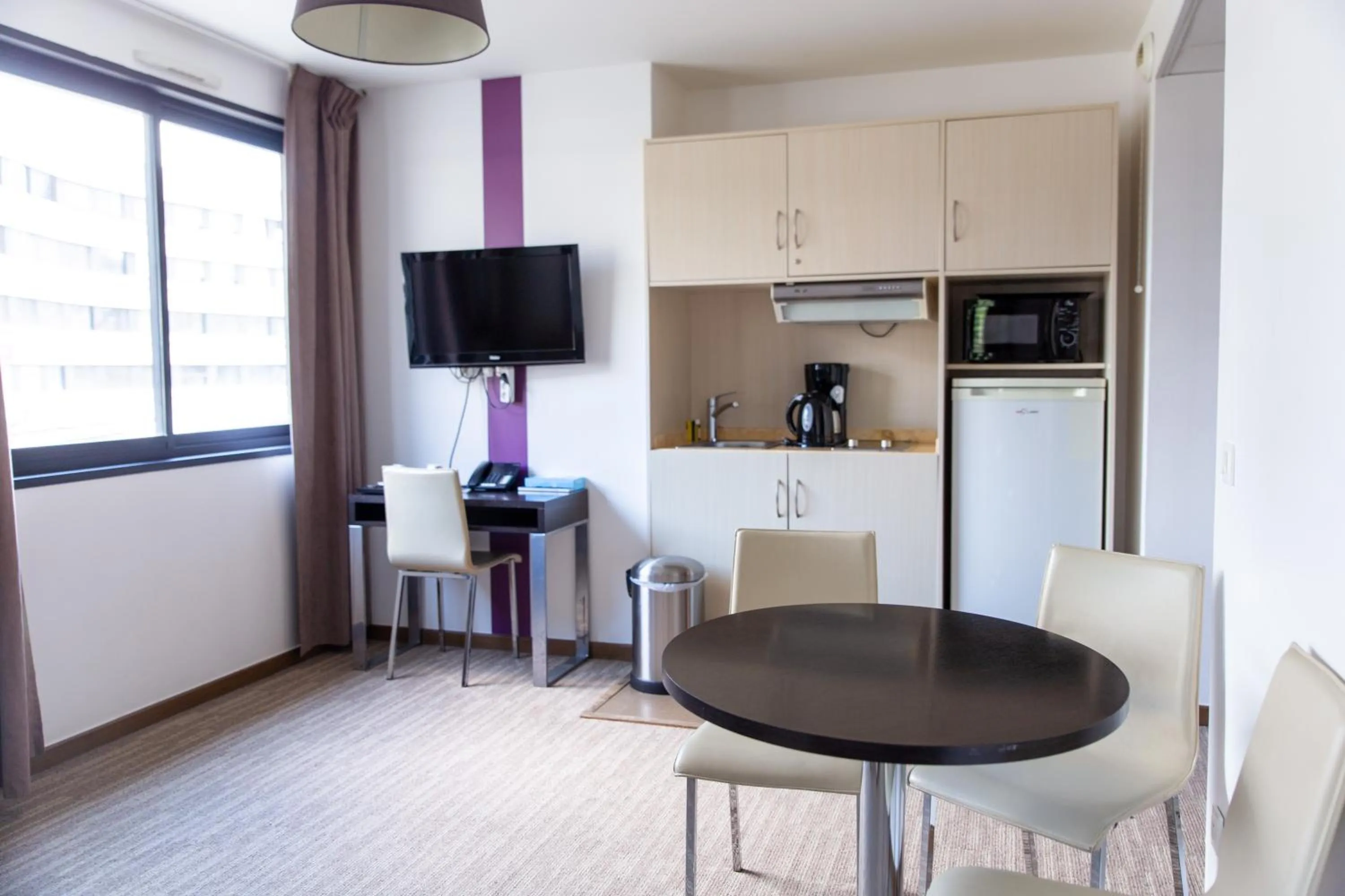 Seating area in Zenitude Swiss Apparthotels