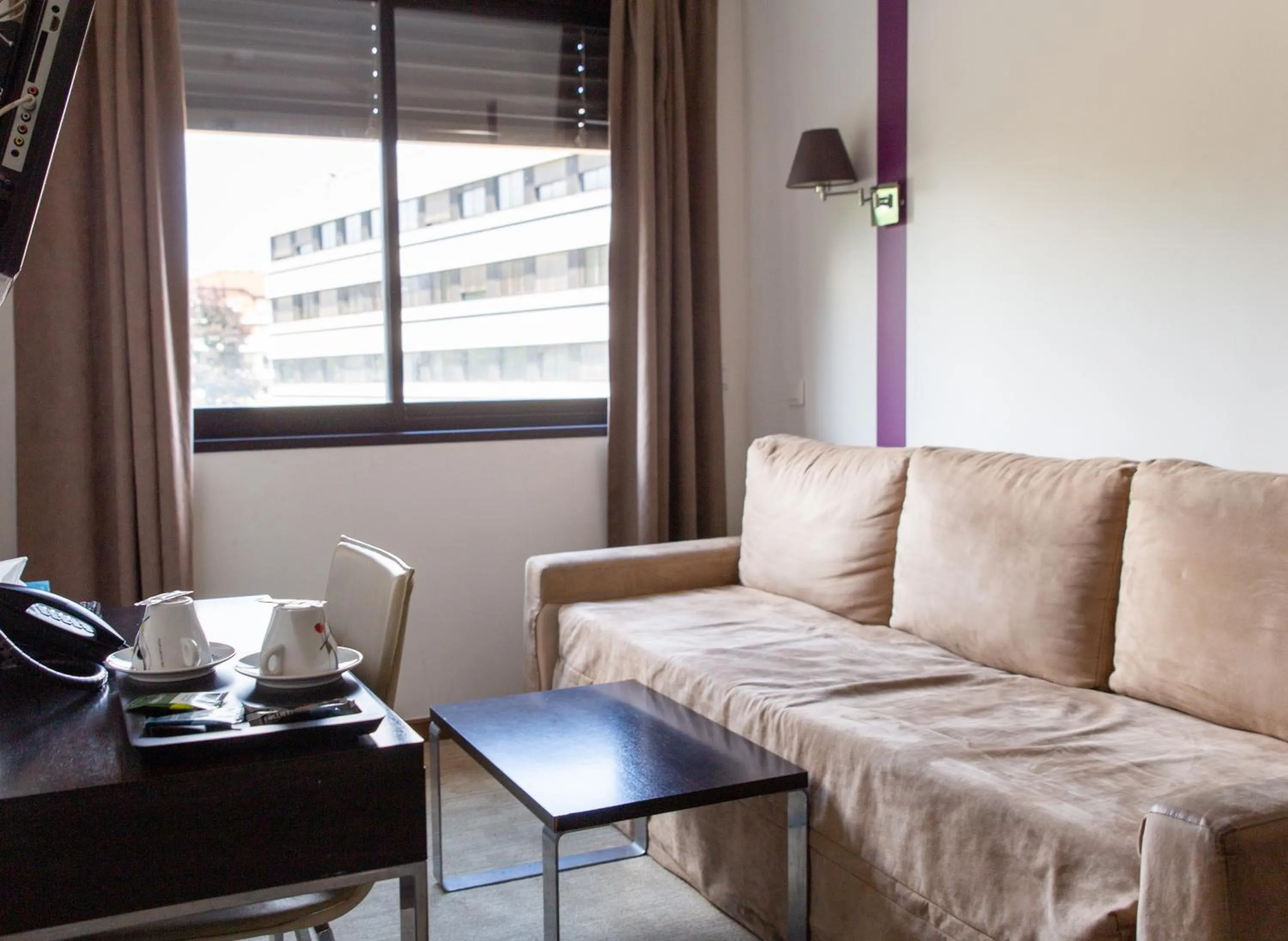 Seating area in Zenitude Swiss Apparthotels