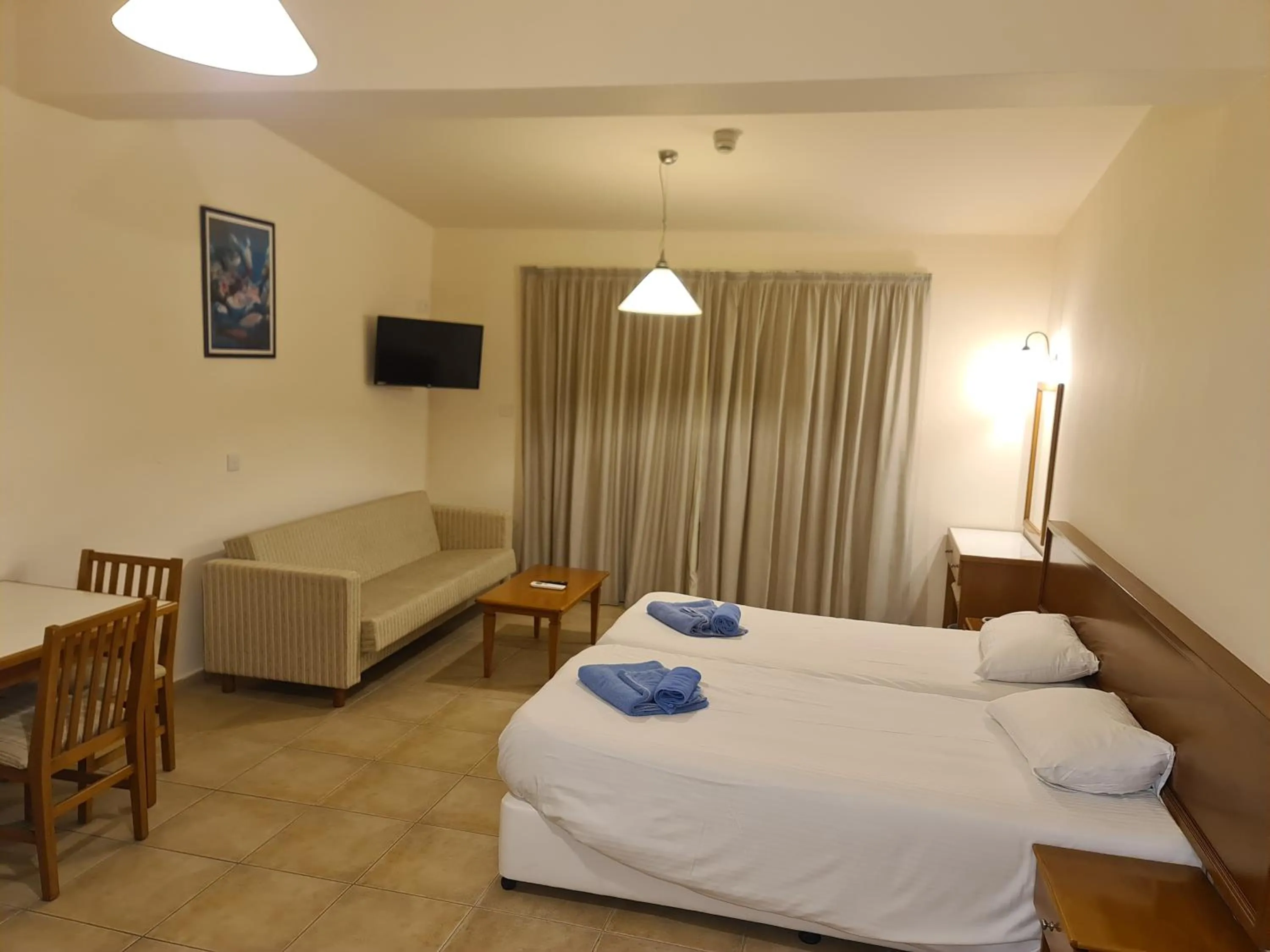 Bed in Nissiana Hotel & Bungalows