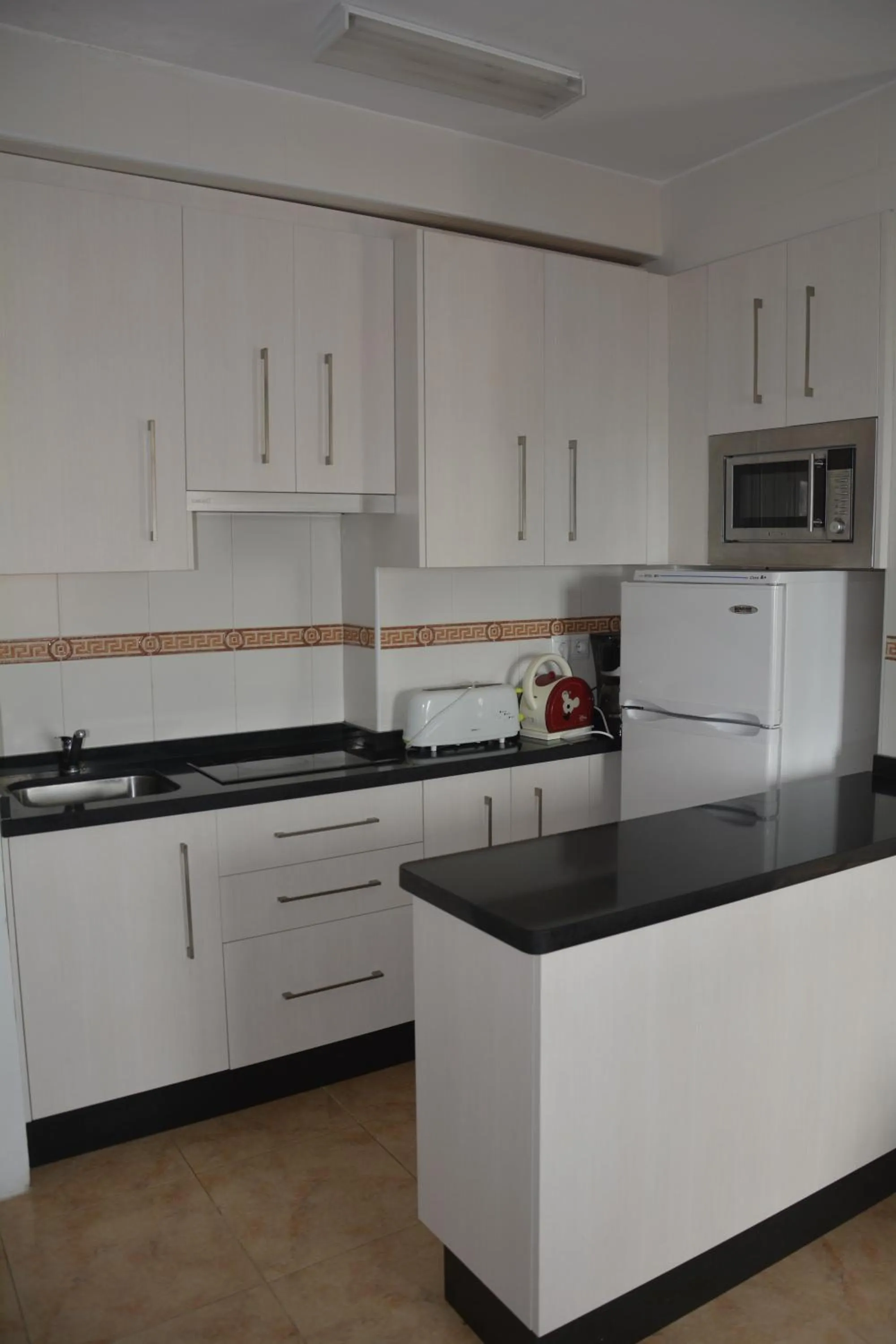 Kitchen or kitchenette in Apartamentos Mediterraneo